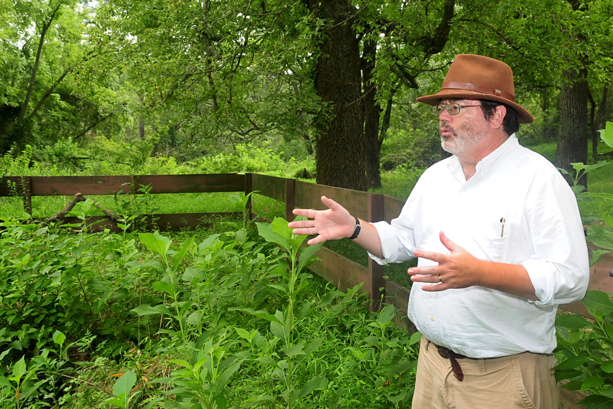 Christopher McDaid, 733rd Civil Engineer division cultural resources manager, describes the fenced in area of the old Fort Crafford house at Fort Eustis, Va., Aug. 10, 2012. Estimated to have been built between 1730 and 1750, the home was used as an inn and tavern for travelers to rest before catching the Mulberry Island ferry to cross the James River. (U.S. Air Force photo by Staff Sgt. Ashley Hawkins/Released)