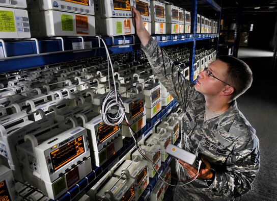 Staff Sgt. Caleb Gibson uses a patient simulator equipment to check Propaq Encore monitors at Joint Base Andrews, Md., Aug. 15, 2012. Gibson is a biomedical equipment technician assigned to the Medical Logistics Flight of the 779th Medical Support Squadron. (U.S. Air Force photo/Val Gempis)
