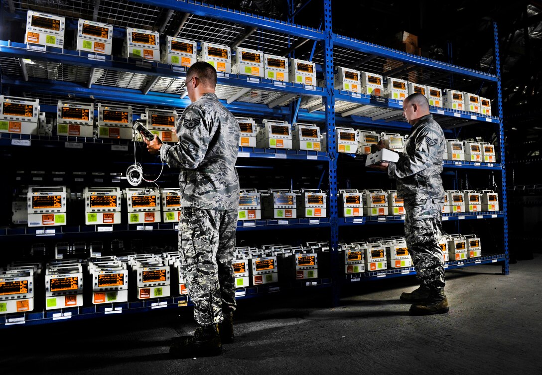 Staff Sgts. Caleb Gibson, left, and Erick Bartels use patient simulator equipment to check Propaq Encore monitors at Joint Base Andrews, Md., Aug. 15, 2012. The Airmen are biomedical equipment technicians assigned to the Medical Logistics Flight of the 779th Medical Support Squadron. (U.S. Air Force photo/Val Gempis)