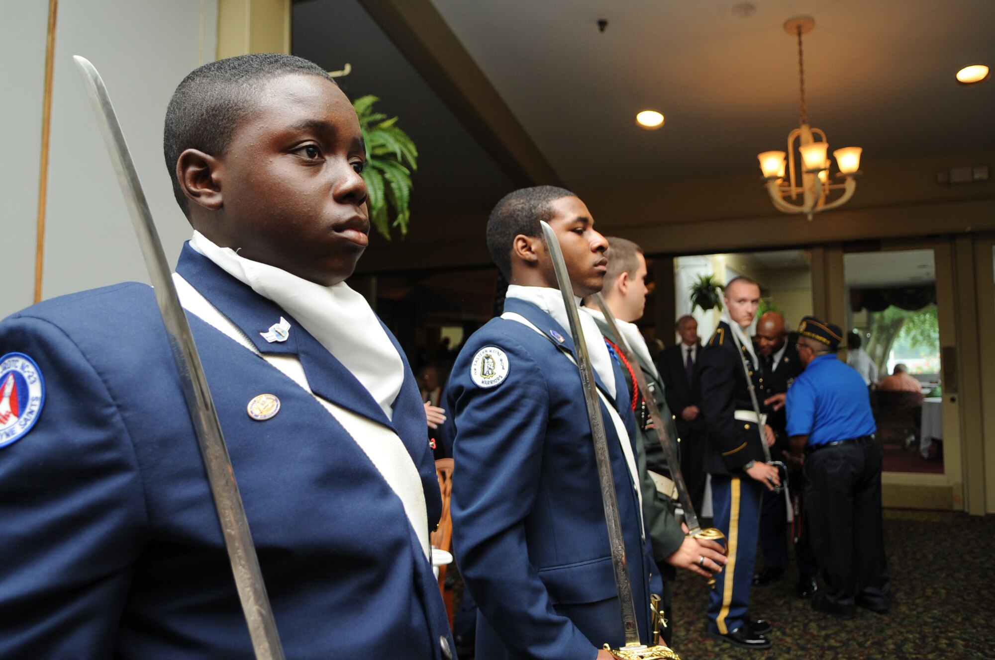 Air Force Junior Reserve Officers’ Training Corps cadets stand at attention during the Purple Heart Banquet at the Walnut Creek Country Club in Goldsboro, N.C., Aug. 10, 2012. Cadets from various JROTC programs in Wayne County performed numerous ceremonial drill movements throughout the banquet. (U.S. Air Force photo/Airman 1st Class Aubrey Robinson/Released)