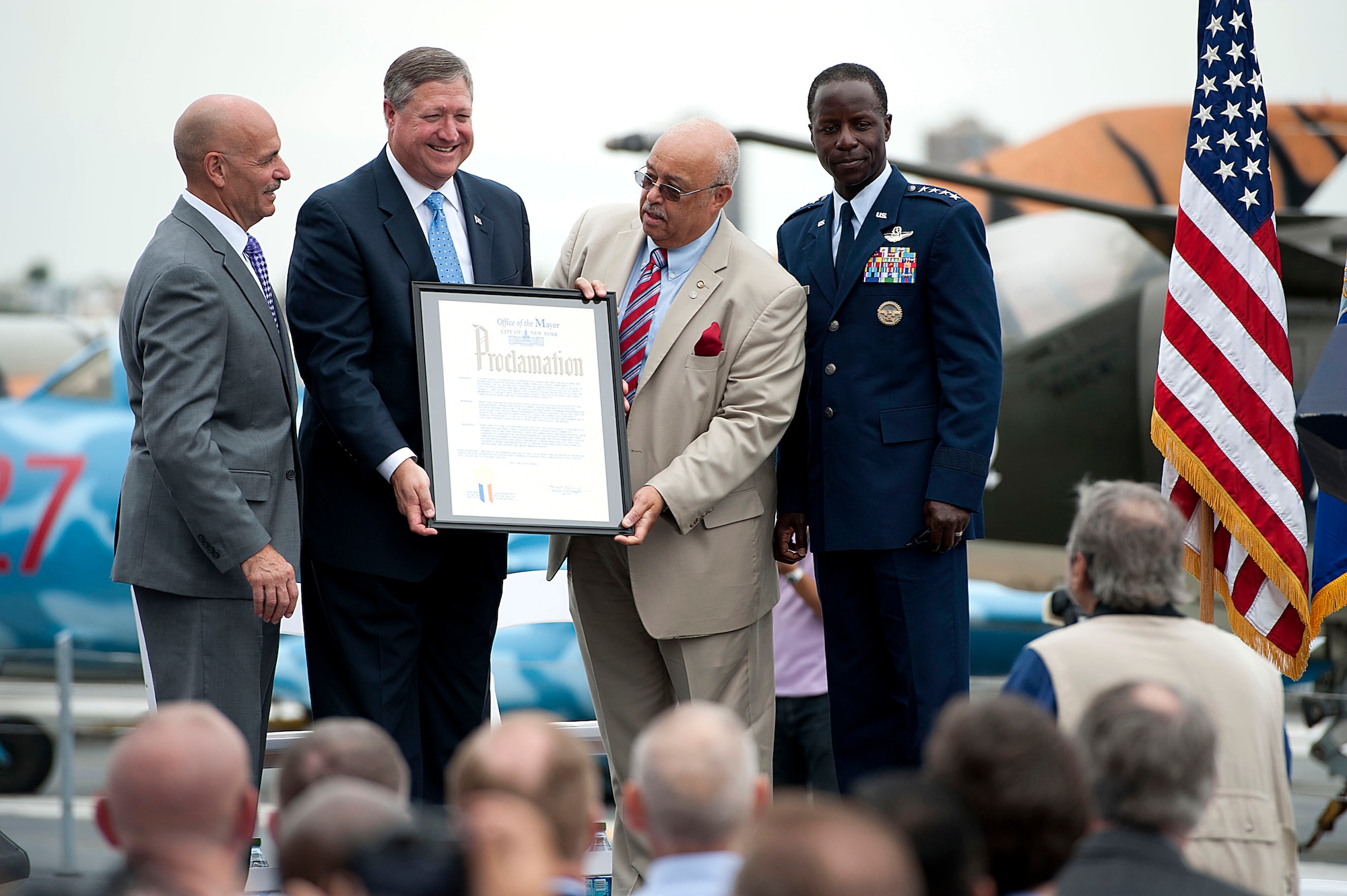 The commissioner of the New York City mayor's Office of Veteran Affairs, Terrance R. Holliday, center, delivers the proclamation stating that the week of August 19-22 is officially Air Force Week in New York City on Aug. 19. (U.S. Air Force photo/Senior Airman Andrew Lee) 
