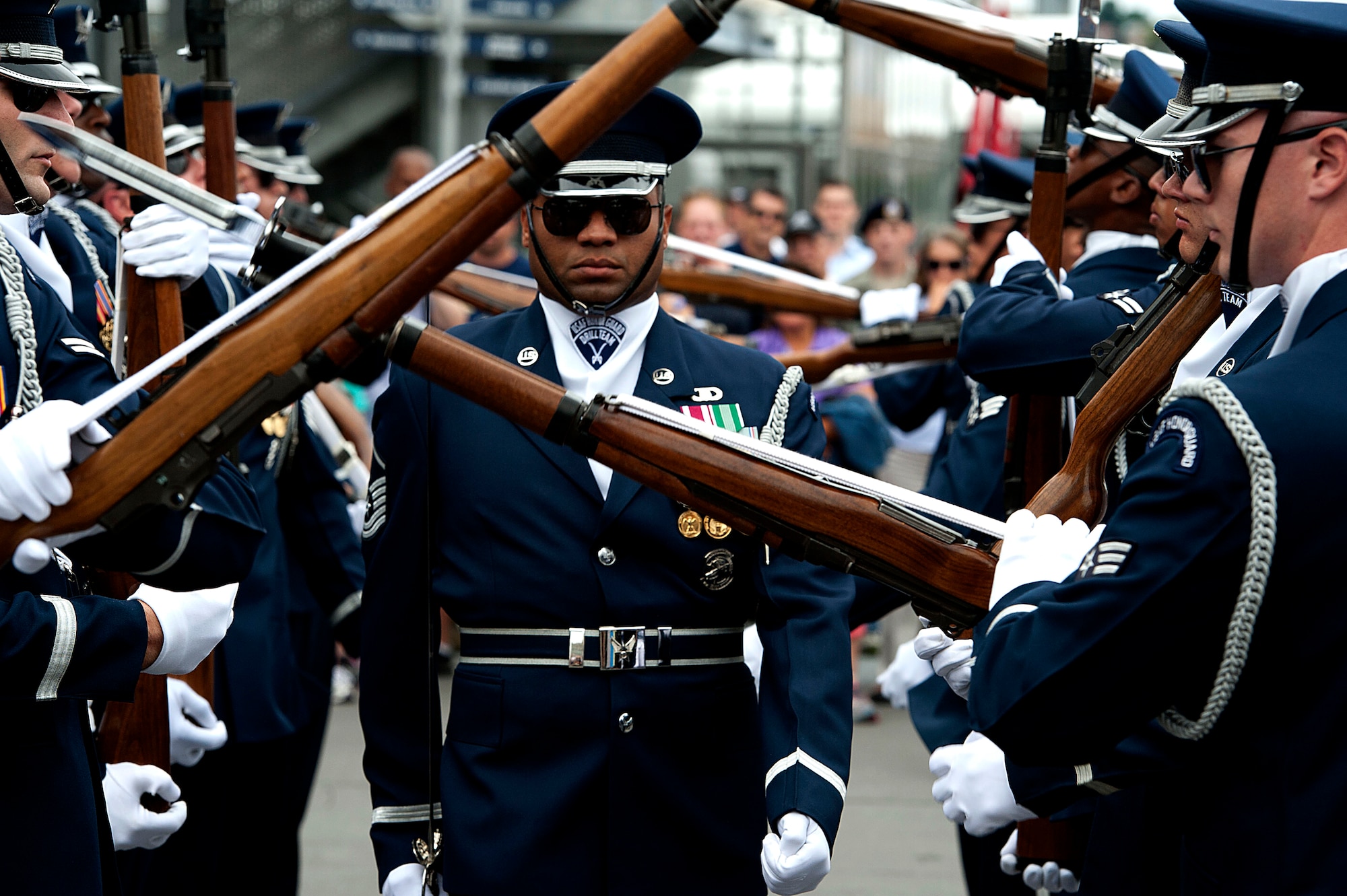 A member of the Air Force Drill Team walks through twirling rifles during a performance at Air Force Week 2012 in New York City on Aug. 19. (U.S. Air Force photo/Senior Airman Andrew Lee) 

