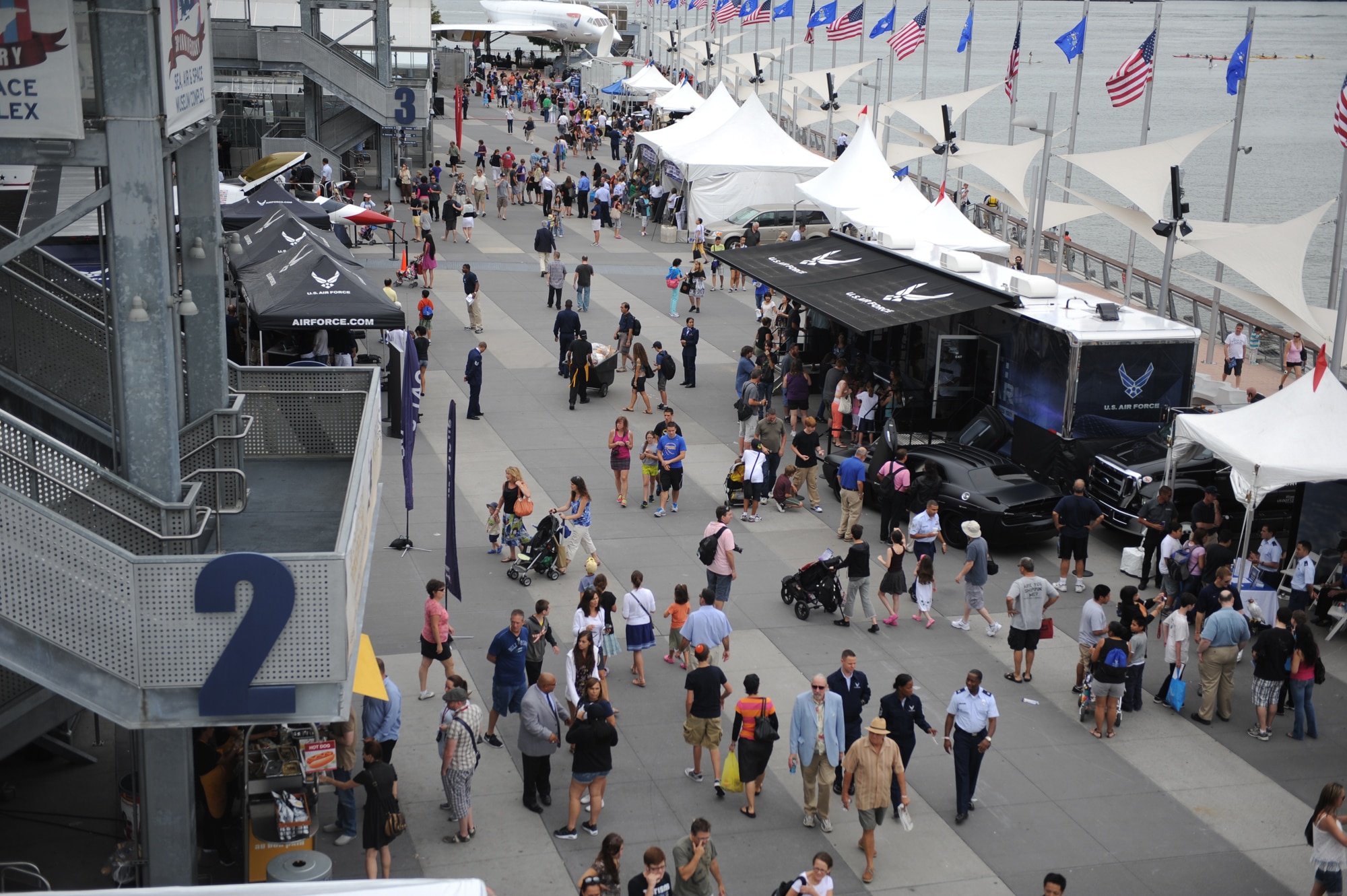 Attendees of Air Force Week 2012 walk around and look at the available events on Pier 86 in New York City on Aug. 19. (U.S. Air Force photo/Master Sgt. Jeremy Lock) 
