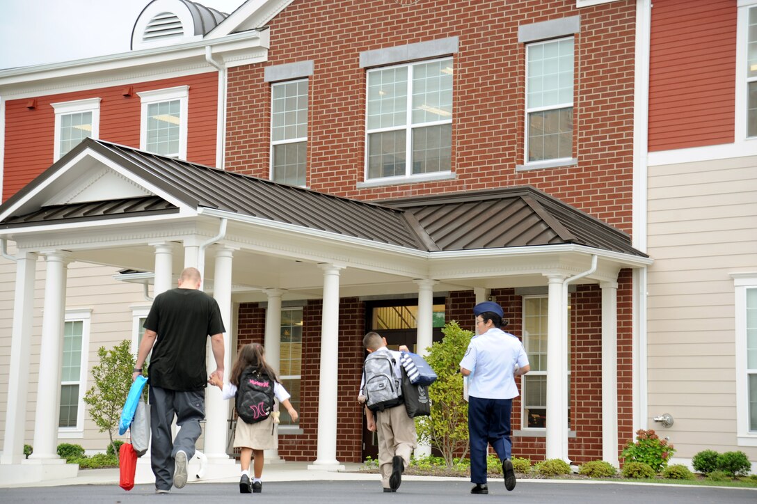 A Team Andrews family walks to the Imagine Andrews Public Charter School at Joint Base Andrews, Md., to begin the new school year Aug. 20,2012.  The school was established in 2011 with a goal of providing "world class education" for military and community students.  A brand new Imagine Andrews building is scheduled to be completed and in use some time next year.  (U.S. Air Force photo/Staff Sgt. Torey Griffith)