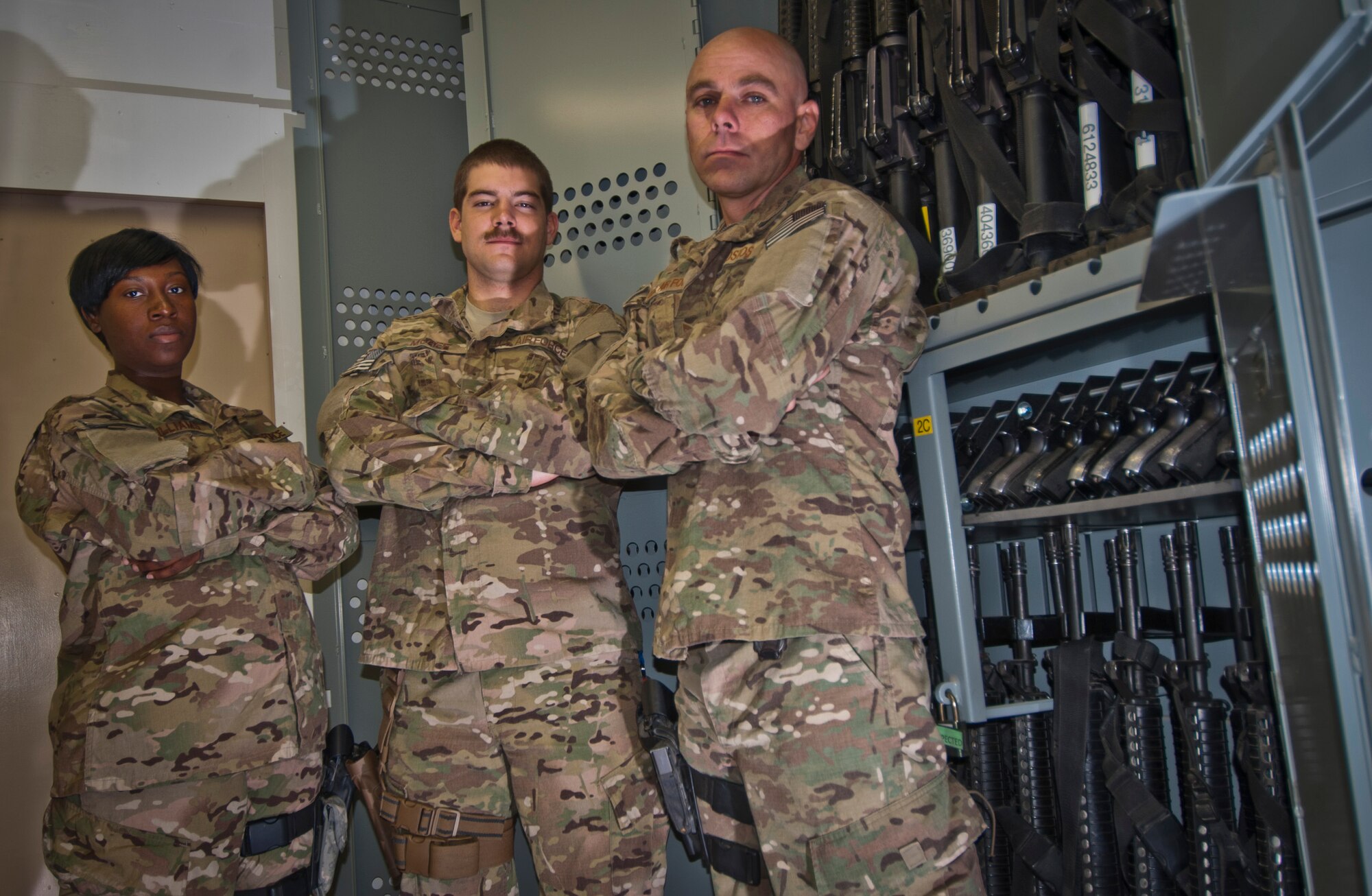 (Left to right) SSgt Kayla Williams, SrA Jonathan McGee and TSgt Matthew Kostos, armory technicians with the 455th Expeditionary Logistics Readiness Squadron, stand next to lockers loaded with M-16 assault rifles and M-9 pistols at Camp Cunningham’s new armory facility at Bagram Airfield, Afghanistan, Aug. 20, 2012. The armory provides a one-stop centralized and secure location for weapons distribution to all 455th Air Expeditionary Wing Airmen. (U.S. Air Force photo/Capt. Raymond Geoffroy)