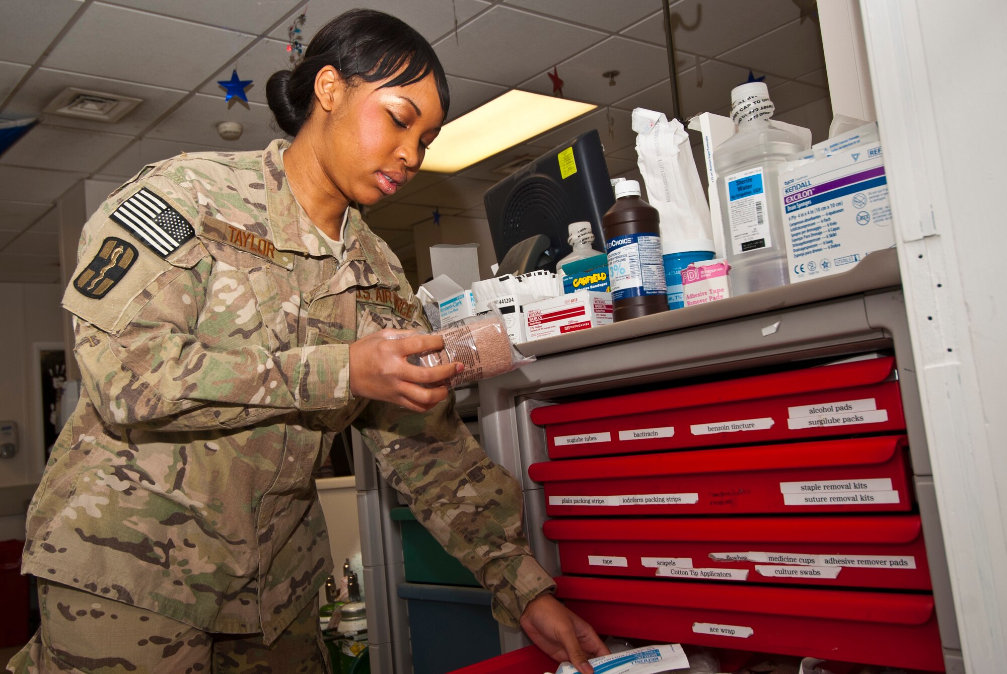 SrA Patience Taylor, 455th Expeditionary Medical Operations Squadron medical technician, checks medical supply expiration dates at the Craig Joint Theater Hospital at Bagram Airfield, Afghanistan, Aug. 20, 2012. As a CJTH Intermediate Care Ward shift leader, Taylor coordinated duty assignments for four technicians ensuring care for 42 wounded and critically-ill patients, all while earning credits towards her Community College of the Air Force degree. (U.S. Air Force photo/Capt. Raymond Geoffroy)