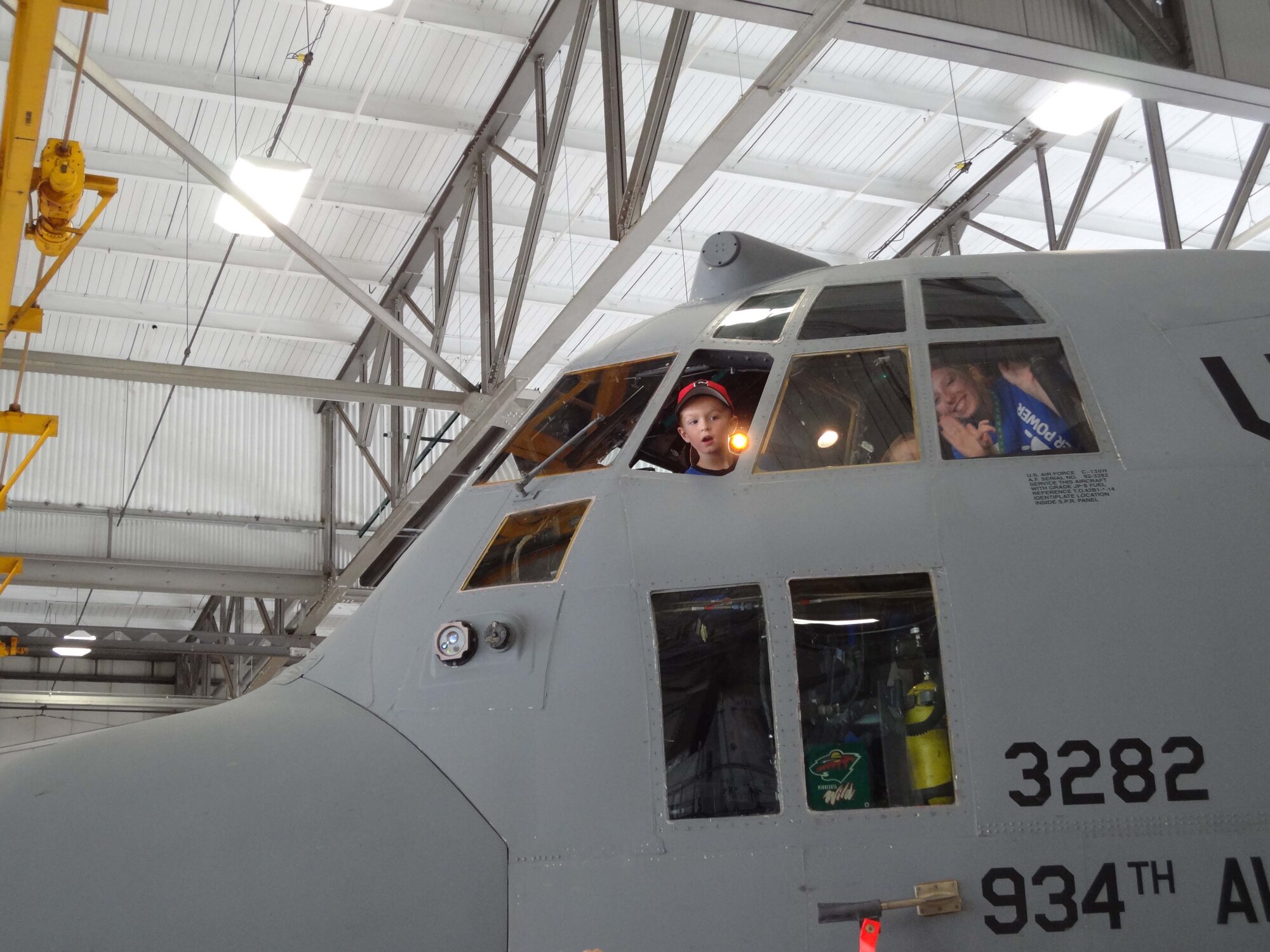 Campers from the Greater Twin Cities YMCA get a view from the cockpit of a C-130 aircraft during their tour Aug. 16. (Air Force Photo/Paul Zadach)