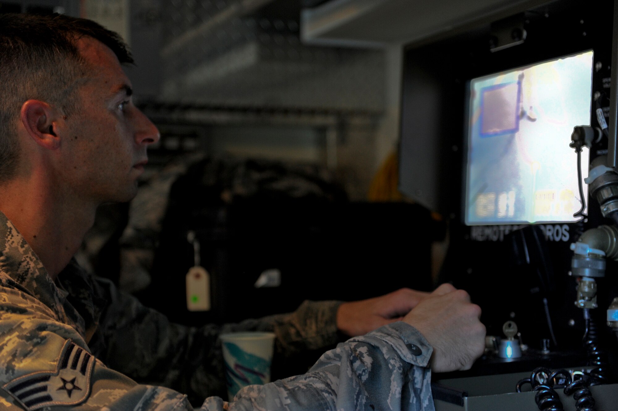 U.S. Air Force Senior Airman Quentin Tubbs, 18th Civil Engineer Squadron explosive ordnance disposal, drives the Remotec ANDROS F-6A robot by remote control during Beverly High 12-5 local operational readiness exercise on Kadena Air Base, Japan, Aug. 20, 2012. Tubbs controls the unmanned, remote-controlled robot that is able to assess hazardous areas that could cause human casualties. The week-long exercise tests Kadena Airmen on their ability to survive and operate in a multitude of scenarios in order to prepare them for real world contingencies.(U.S. Air Force photo/Airman 1st Class Justin Veazie)