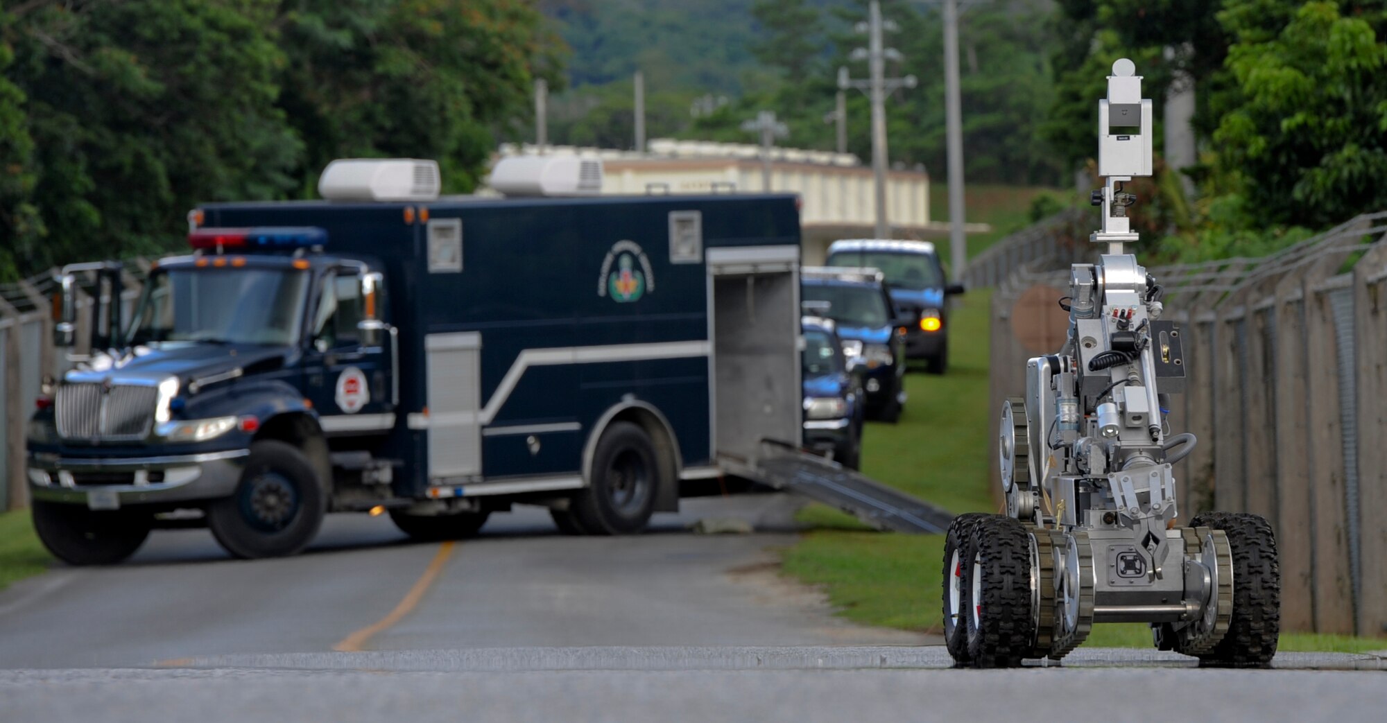 A Remotec ANDROS F-6A robot travels down a road to assess the scene in a training scenario during Beverly High 12-5 local operational readiness exercise on Kadena Air Base, Japan, Aug. 20, 2012. The week-long exercise tests Kadena Airmen on their ability to survive and operate in a multitude of scenarios in order to prepare them for real world contingencies. (U.S. Air Force photo/Airman 1st Class Justin Veazie)