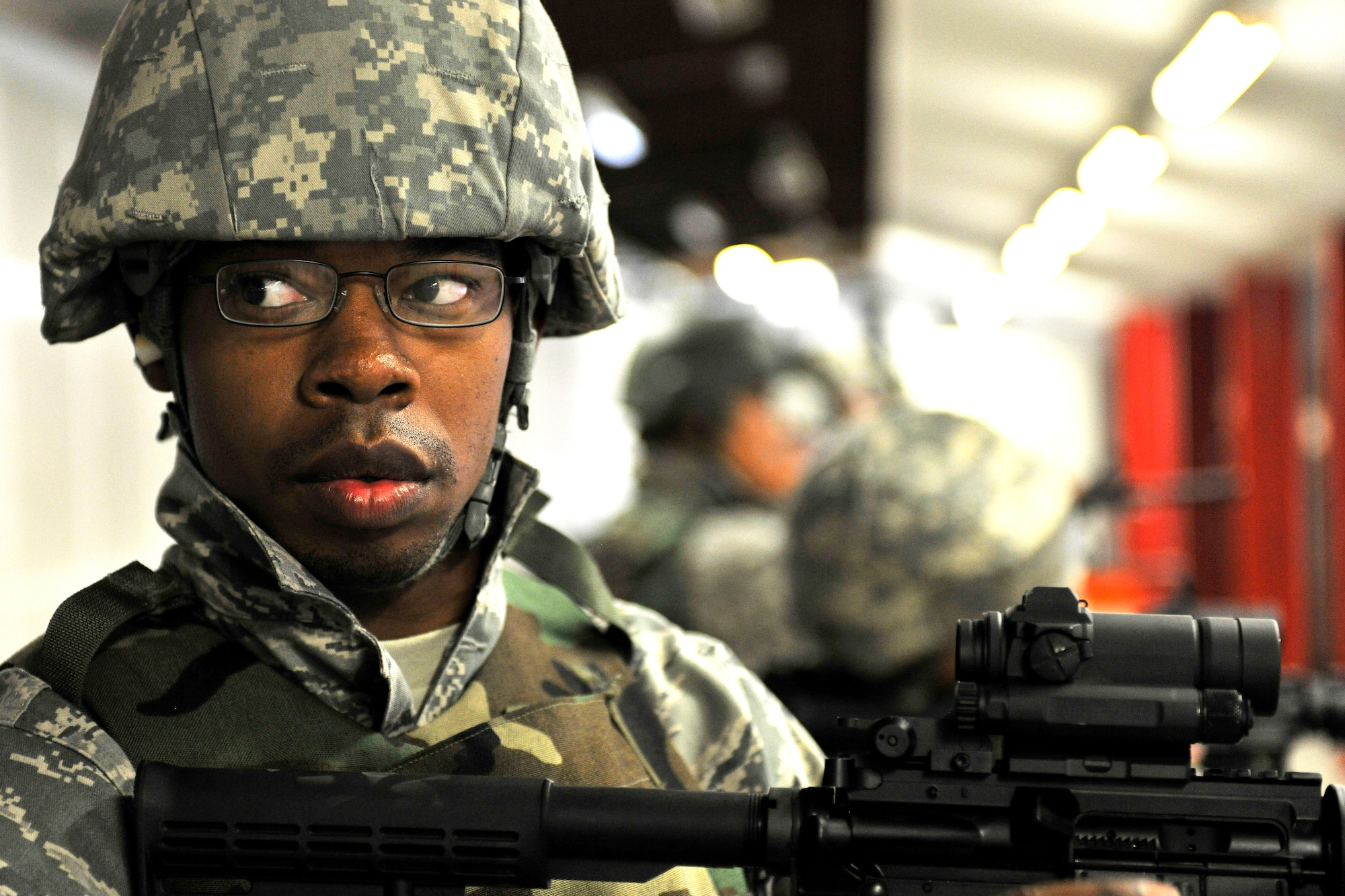 Airman 1st Class Demarc Shorter, a 721st Aerial Port Squadron passenger services specialist, awaits shooting instructions at Vogelweh Military Complex, Germany, Aug. 10, 2012.  The 569th Combat Arms Training and Maintenance instructors qualify more than 7,000 students annually, and have the highest tempo for qualifications within U.S. Air Forces Europe.  (U.S. Air Force photo/Senior Airman Chris Willis)