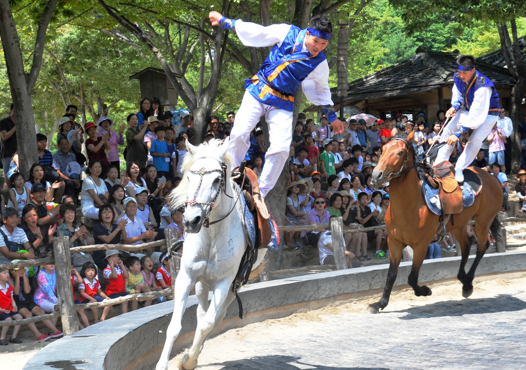 Equestrian performers put on a show at the Korean Folk Village Aug. 17, 2012. The folk village, located eight miles outside Osan Air Base’s main gate in the heart of Yongin, offers a gateway for service members and their families into Korea’s past. (U.S. Air Force photo/Staff Sgt. Stefanie Torres)