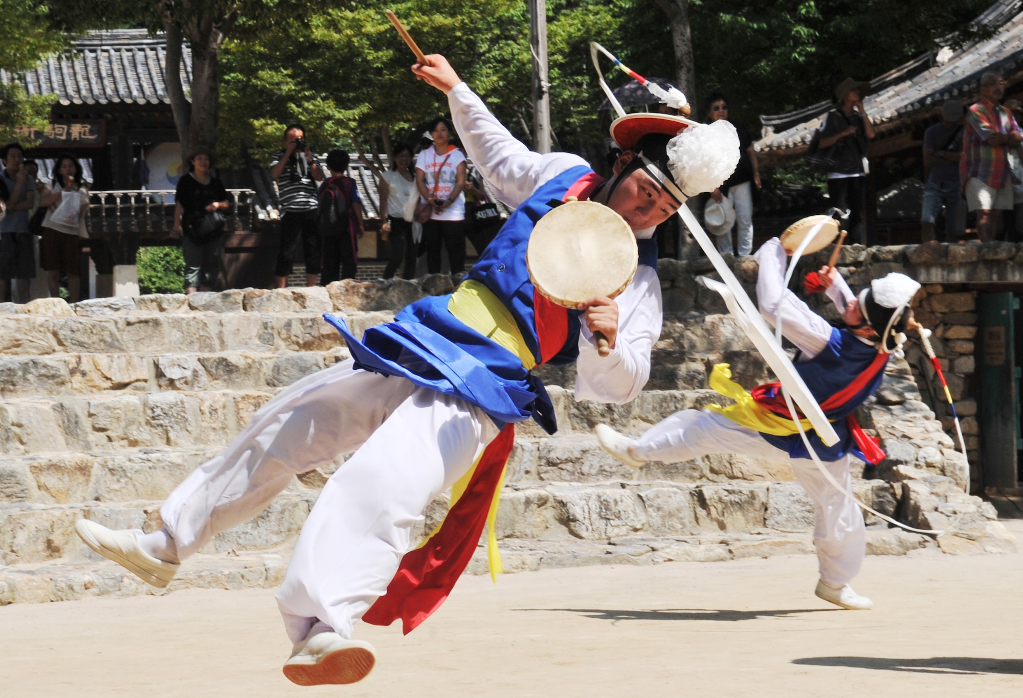 Performers at the Korean Folk Village exercise their music and dancing skills during a show Aug. 17, 2012. The folk village’s 243 acres contain more than 260 traditional Korean homes reminiscent of the Joseon Dynasty period from 1392-1910. (U.S. Air Force photo/Staff Sgt. Stefanie Torres)