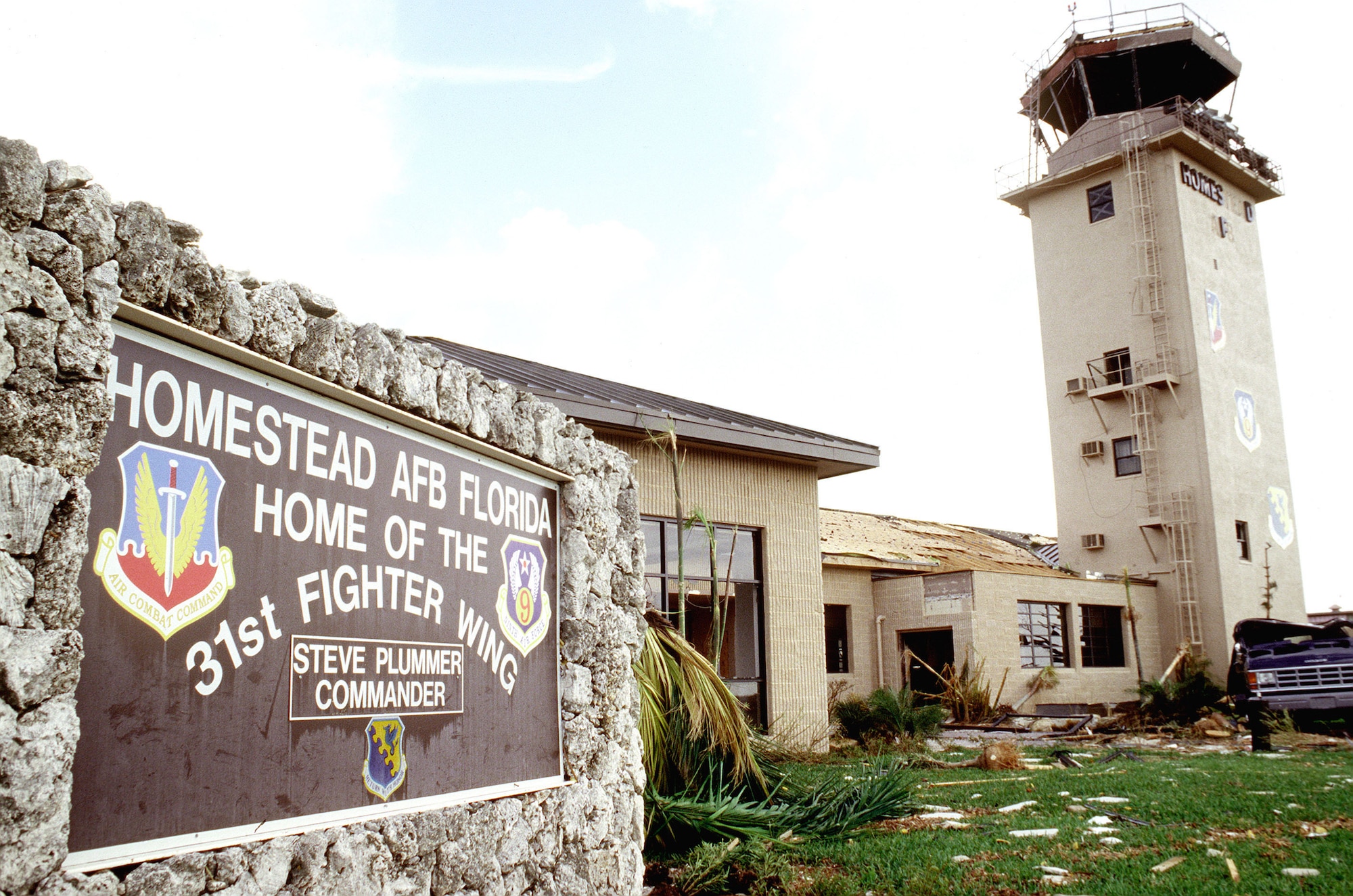 Damaged control tower and welcome sign. Hurricane Andrew damaged every building on base and destroyed many. (U.S. Air Force photo/MSgt Don Wetterman)