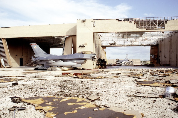 A pair of F-16 Fighting Falcons which were left in the alert complex at Homestead Air Force Base, Fla., lay ruined after the hangar they were stored in was destroyed by Hurricane Andrew. (U.S. Air Force photo/MSgt Don Wetterman) 

