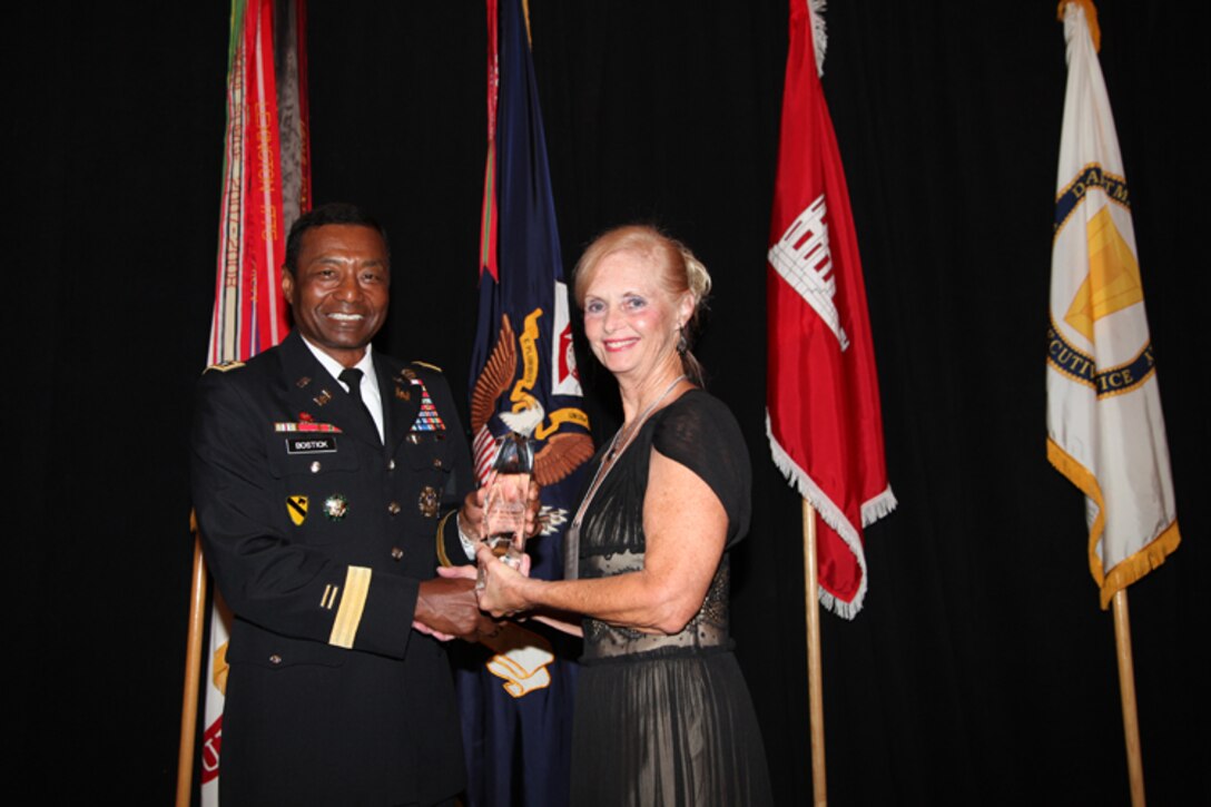 Kristine Brown, U.S. Army Corps of Engineers Galveston District Park Ranger and Water Safety Program Manager, was selected as the 2012 Ronald J. Ruffennach Communicator of the Year - an award to recognize a member of the Corps outside of the Public Affairs career field for his/her outstanding contributions in communicating the USACE missions and programs. She is presented with the award by Lt. Gen. Thomas P. Bostick, U.S. Army Chief of Engineers and Commanding General of the USACE, at the 2012 Senior Leaders Conference in Little Rock, Ark. August 2012.