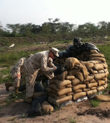 U.S. Marines with the 24th Marine Expeditionary Unit prepare demolitions charges on a training range in Uganda while participating in a training mission with members of the Uganda People's Defense Force.  The Marines have been in Uganda since July providing training assistance to the UPDF in a variety of skills including marksmanship, small unit tactics, and engineering.  The 24th MEU is deployed with the Iwo Jima Amphibious Ready Group as a theater reserve and crisis response force in the U.S. Central Command and 5th Fleet areas of responsibility.