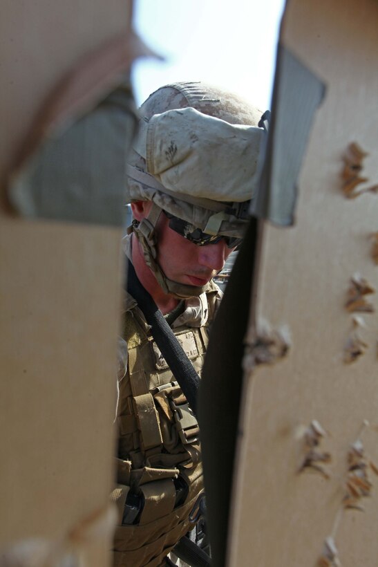 A Marine with Battalion Landing Team 1st Battalion, 2nd Marine Regiment, 24th Marine Expeditionary Unit, replaces his target after conducting a multiple target, live-fire range on the flight deck of USS Iwo Jima, Aug. 19, 2012. The Marines conduct various live fire ranges while underway to keep their skills sharp during deployment. The 24th MEU is deployed with the Iwo Jima Amphibious Ready Group as a theater reserve force for U.S. Central Command and is providing support for maritime security operations and theater security cooperation efforts in the U.S. Navy's 5th Fleet area of responsibility.