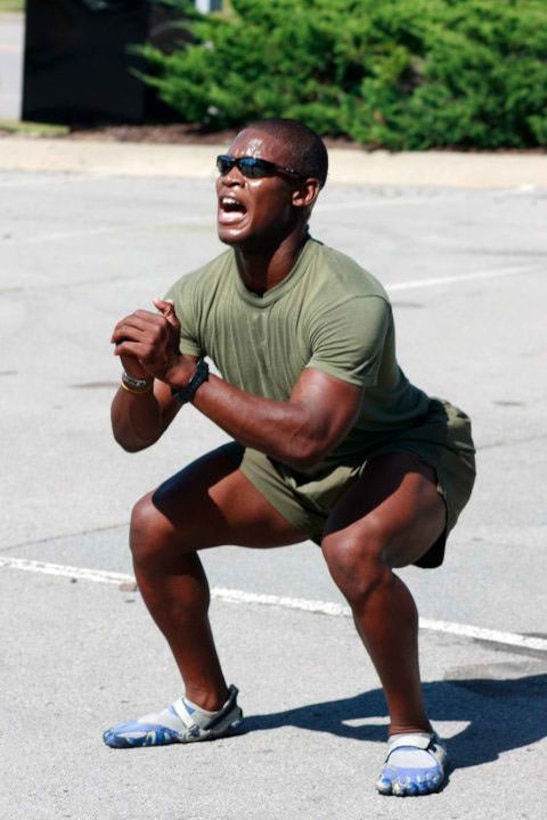 Staff Sgt. Brandon C. Dinkins, a recruiter assigned to MCRS Nashville, Sub Station Franklin, does a body weight squat during one of his pool PT sessions.