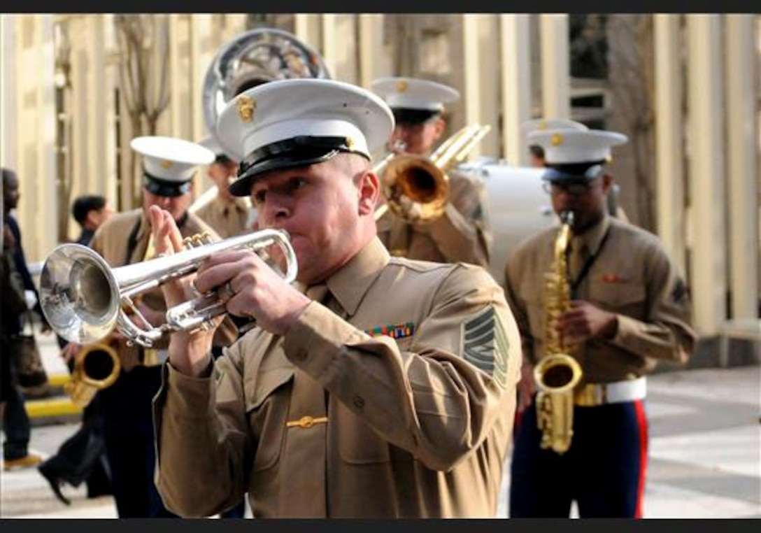 Gunnery Sgt. Jeffrey Frank, staff non-commissioned officer in-charge of the 2nd Marine Aircraft Wing Band, leads his band in concert on the streets of Charlotte, N.C., March 2, 2012. In addition to impromptu performances on the streets, the 2nd MAW band performed at the fan experience exhibit held at the Charlotte Convention Center for the Central Intercollegiate Athletic Conference basketball tournament. (Official U.S. Marine Corps photo by Sgt. Michael V. Walters) (Released)