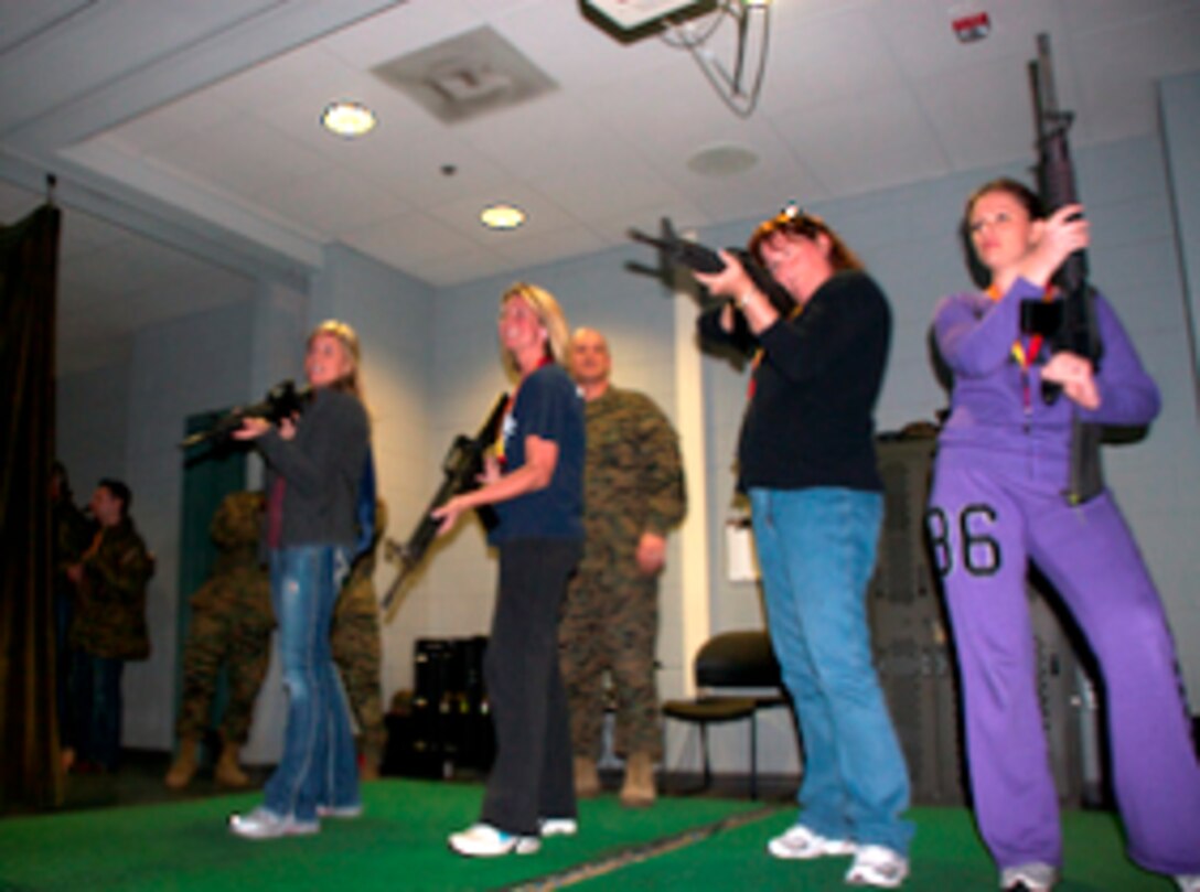 Educators from Florida, Georgia and South Carolina practice firing M-16 A2 service rifles at the Indoor Simulated Marksmanship Trainer aboard Marine Corps Recruit Depot Parris Island, SC, before heading downrange for a live-fire exercise. The educators were visiting the installation for three days during Recruiting Station Jacksonville's 2012 Educators Workshop, taking place from March 6-9.