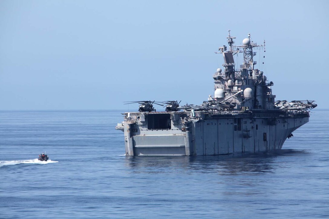 A rigid-hull inflatable boat approaches the USS Peleliu, transporting servicemembers from the USS Rushmore, Aug. 18, during the 15th Marine Expeditionary Unit and Peleliu Amphibious Ready Groupâ€™s final pre-deployment training evolution, Certification Exercise. The MEUâ€™s mission capabilities and performance will be evaluated during the exercise to ensure it is ready to deploy later this year.