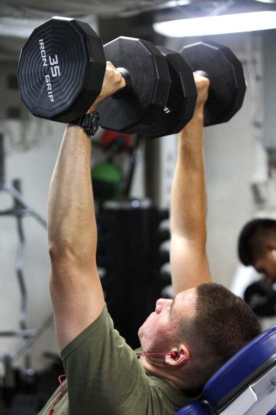 Lance Cpl. Zachary Vogt, field artilleryman, Battery B, Battalion Landing Team 3/5, 15th Marine Expeditionary Unit, lifts weights inside one of three fitness rooms aboard the USS Rushmore, Aug. 18. Marines from the MEU exercise regularly during the unitâ€™s final training evolution, Certification Exercise. CERTEX differs from previous exercises because Marines and Sailors react to unknown scenarios using the Marine Corpsâ€™ Rapid Response Planning Process.