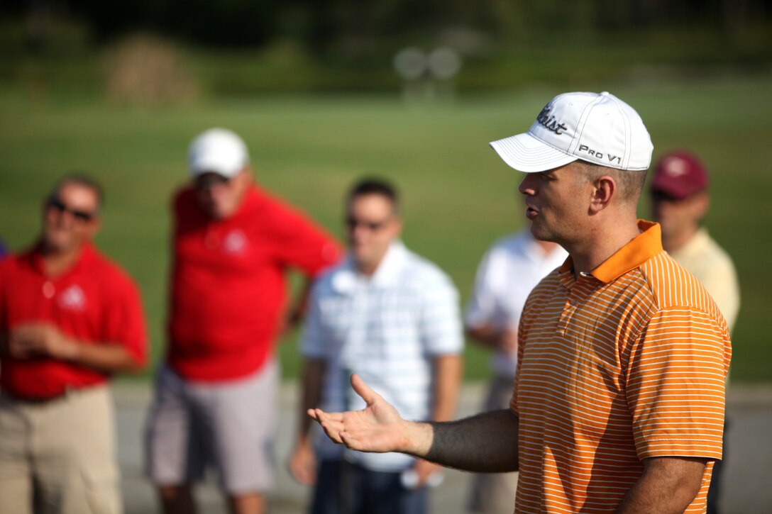 Lt. Cmdr. David W. Jones, the director of French Creek Dental Clinic, 2nd Dental Battalion, 2nd Marine Logistics Group, speaks to fellow dental officers before beginning a battalion golf tournament aboard Camp Lejeune, N.C., Aug. 17, 2012. The tournament was part of the Navy Dental Corps’ 100th anniversary celebration.  The command took the opportunity to build camaraderie and also collect money to help wounded warriors. The sailors raised approximately $1700 to donate to the fund.