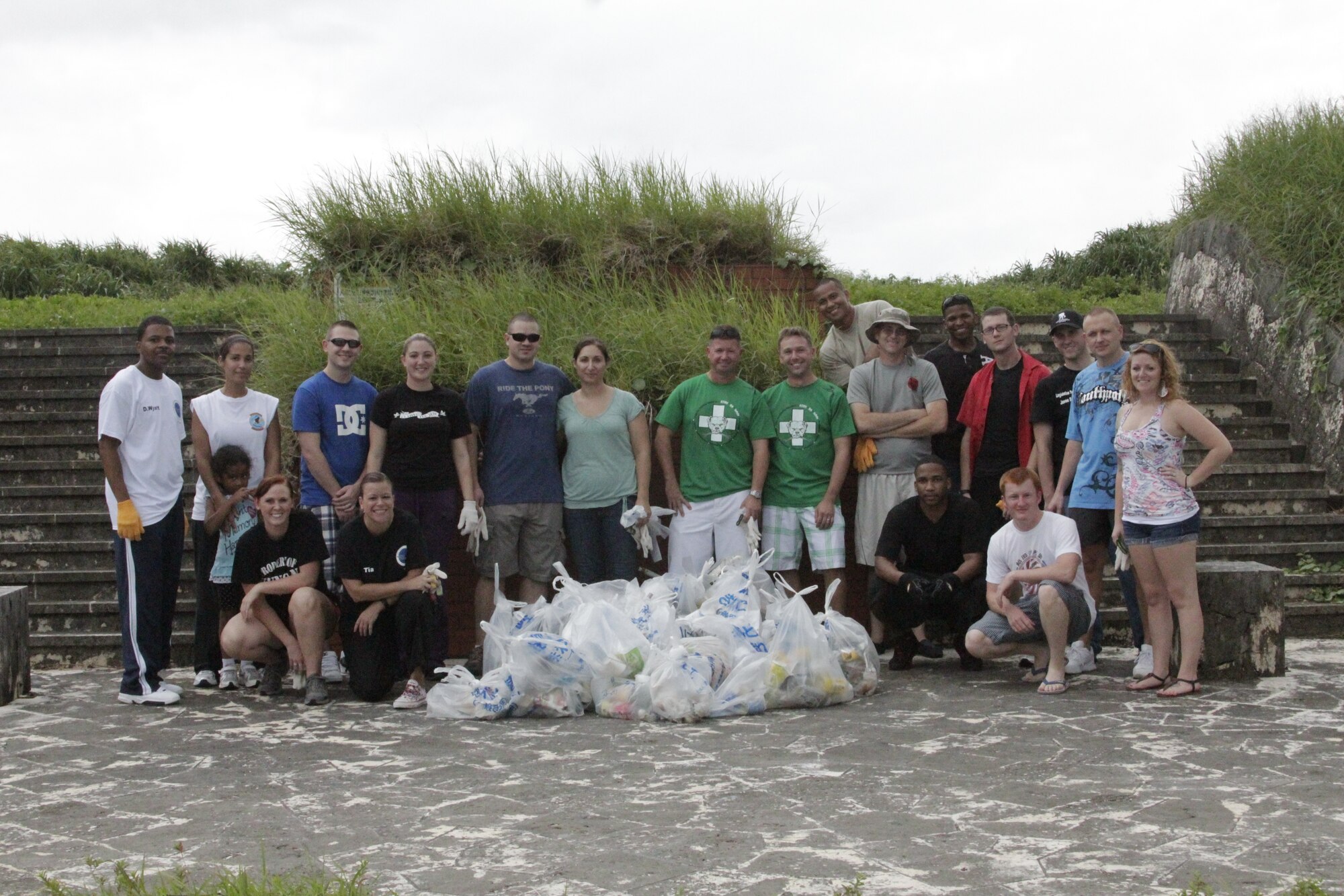 Airmen from the Kadena Air Force Sergeants Association, Chapter 1553, pose with 30 bags of trash they collected from Cape Zanpa Park, Okinawa, Aug. 3, 2012. During the hour the 20 Airmen worked, they were able to not only gather the trash, but also clean up in the local community. (Courtesy photo)