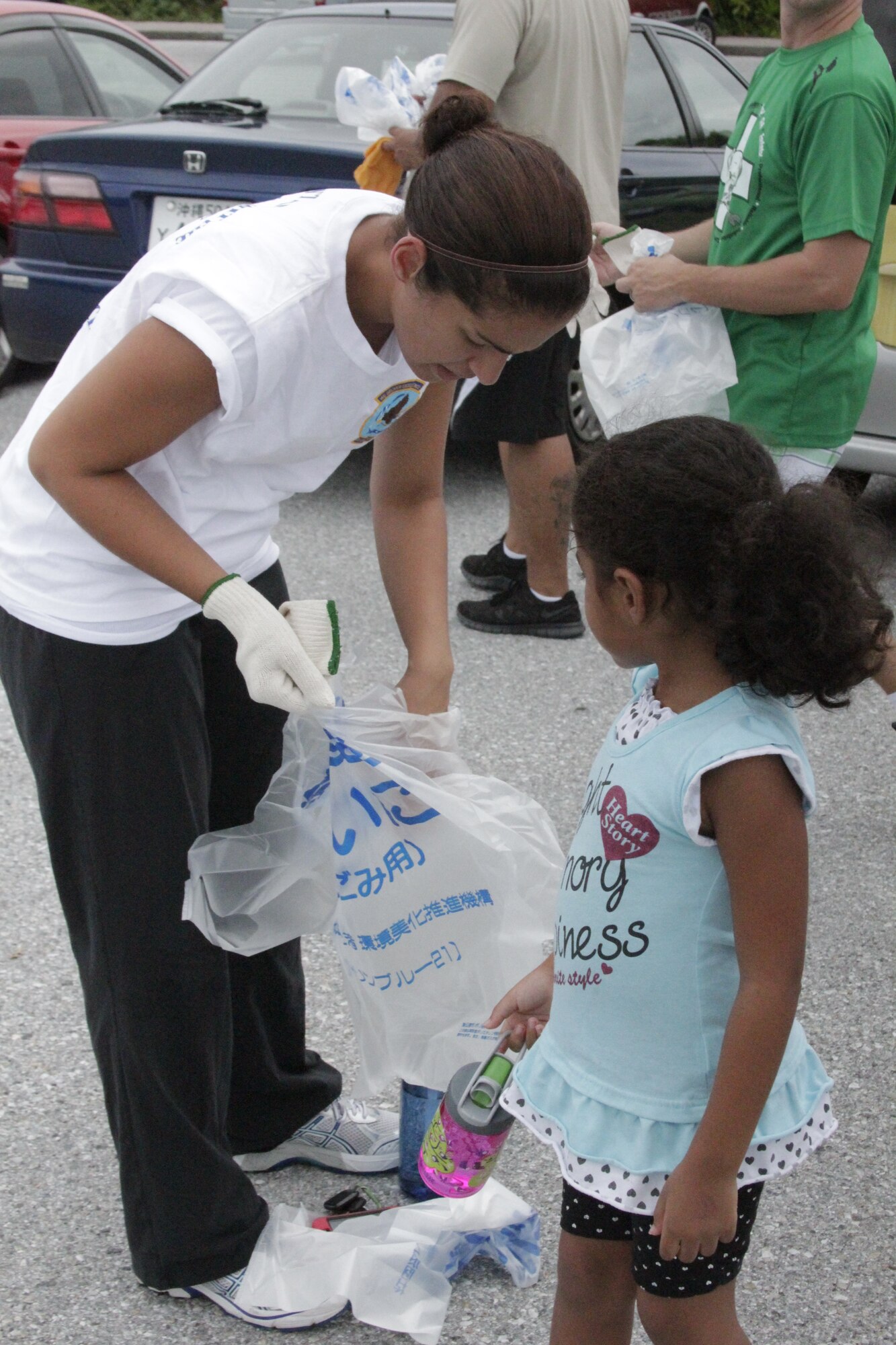 Airmen from the Kadena Air Force Sergeants Association, Chapter 1553, collect trash at Cape Zanpa Park, Okinawa, Aug. 3, 2012. The 20 volunteers cleaned up in the local community and collected a total of 30 bags of trash consisting of bottles, cans and other combustible and non-combustible items. (Courtesy photo)
