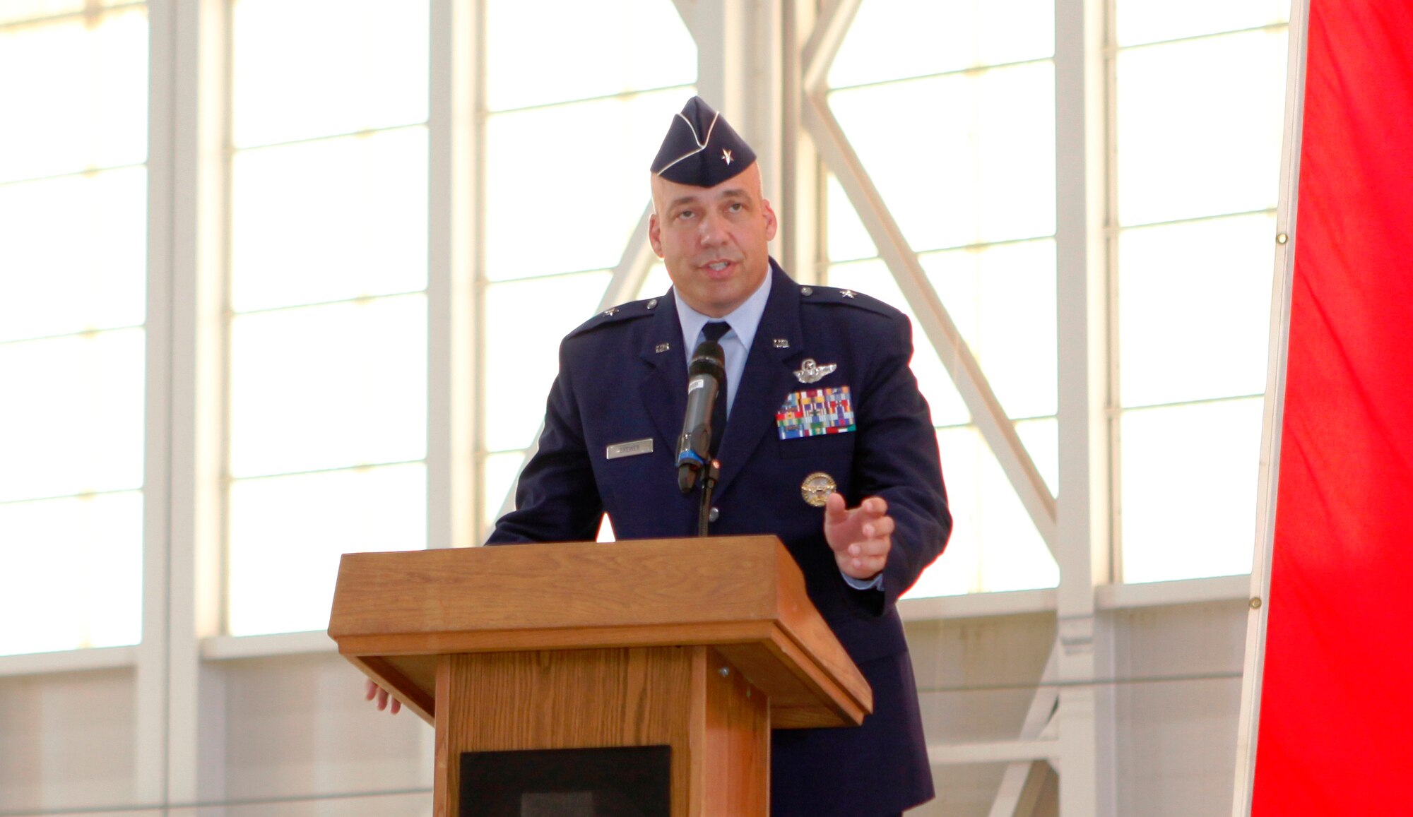 Brig. Gen. Micheal T. Brewer, 412th Test Wing commander, speaks at the 412th TW change of command and Air Force Test Center redesignation ceremony July 13, 2012. (U.S. Air Force photo by Jet Fabara)