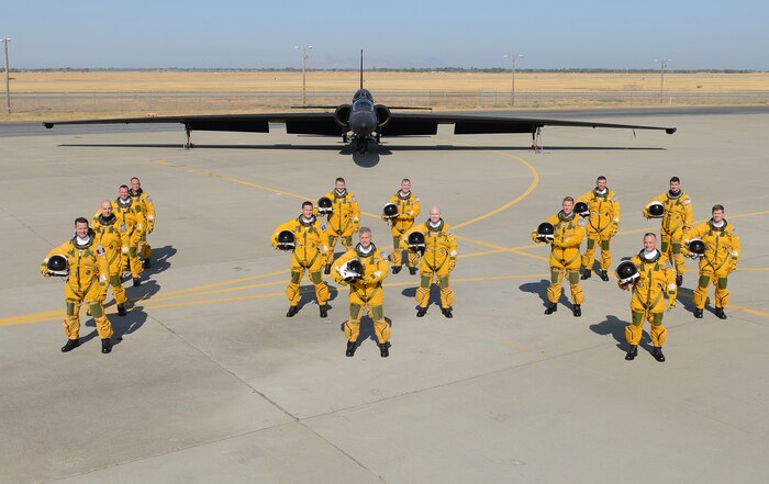 Fourteen U.S. Air Force U-2S Dragon Lady Intelligence, Surveillance and Reconnaissance Aircraft instructor pilots from the 1st Reconnaissance Squadron pose for a photo in front of a two seat U-2S August 17, 2012 at Beale Air Force Base, Calif. Less people have piloted the U-2 than have earned Super Bowl rings. (U.S. Air Force photo by Mr. John Schwab/Released)