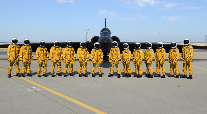 Fourteen U.S. Air Force U-2S Dragon Lady Intelligence, Surveillance and Reconnaissance Aircraft instructor pilots from the 1st Reconnaissance Squadron pose for a photo in front of a two seat U-2S August 17, 2012 at Beale Air Force Base, Calif. Less people have piloted the U-2 than have earned Super Bowl rings. (U.S. Air Force photo by Mr. John Schwab/Released)
