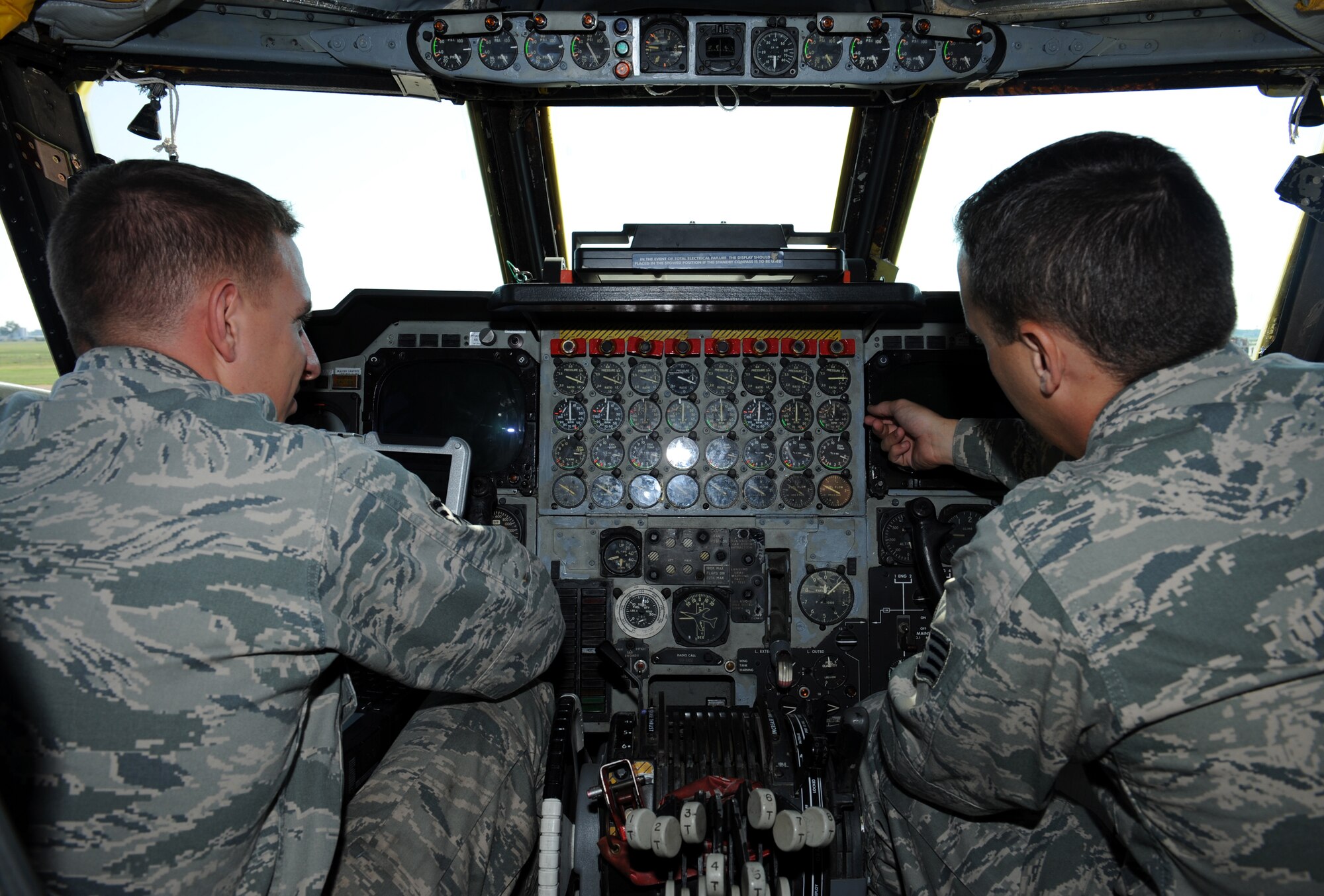 Senior Airman James Lawson, 2nd Aircraft Maintenance Squadron crew chief, and Staff Sgt. Wesley Cantrell, 2nd Maintenance Group quality assurance, look over the cockpit of a B-52H Stratofortress bomber on Barksdale Air Force Base, La., Aug. 20. Lawson is one of five crew chiefs chosen to represent the 2nd Bomb Wing in the 2012 Global Strike Challenge. Cantrell gauged Lawson's knowledge of the cockpit and advised him on other aspects he may need to know for the competition. (U.S. Air Force photo/Airman 1st Class Benjamin Gonsier)(RELEASED) 
