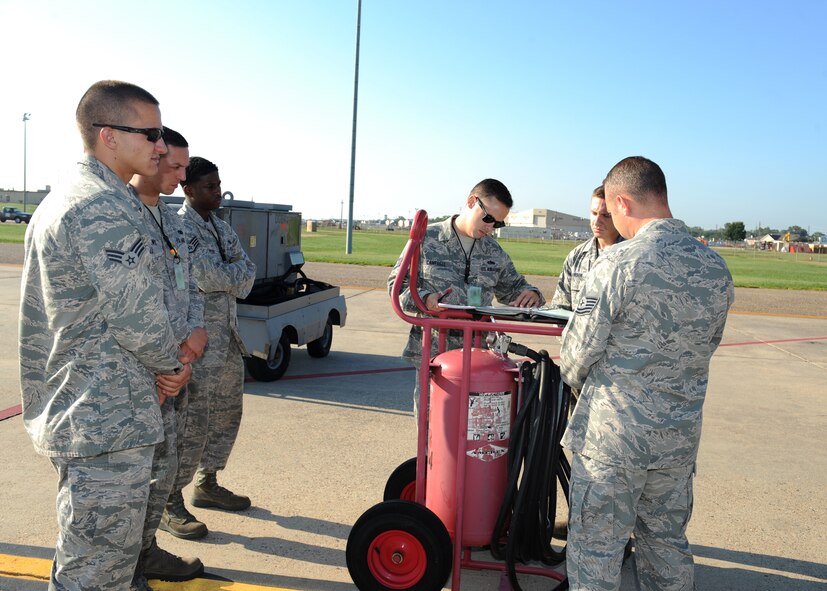 Staff Sgt. Wesley Cantrell, 2nd Maintenance Group quality assurance, inspects an aircraft binder on Barksdale Air Force Base, La., Aug 20. During a dry run in preparation of the 2012 Global Strike Challenge, QA inspected the crew chiefs on how they performed a portion of their pre-flight routine. (U.S. Air Force photo/Airman 1st Class Benjamin Gonsier)(RELEASED)