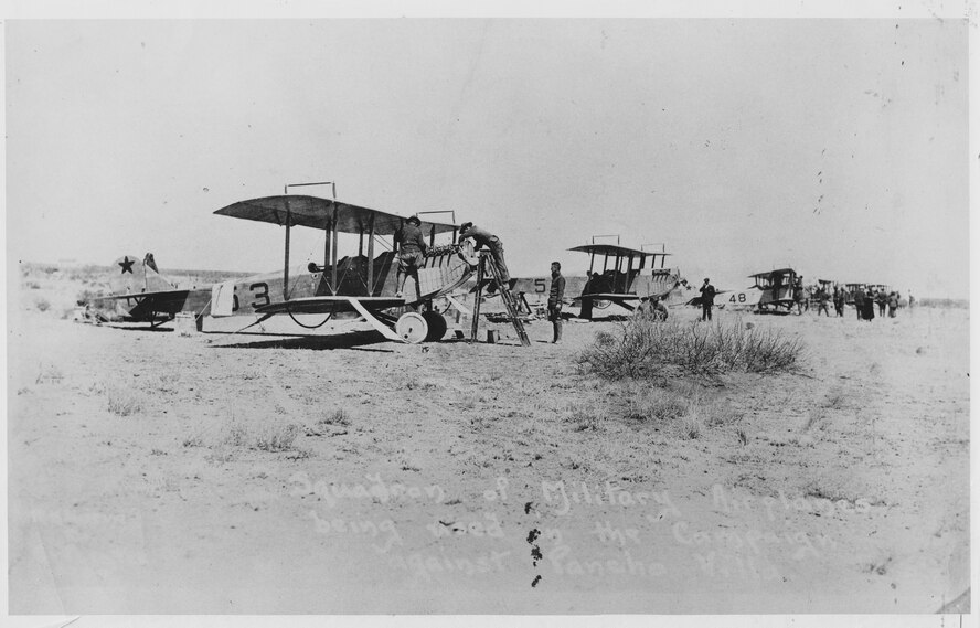 The 1st Aero Squadron in the field. This photograph has to have been taken either at Columbus prior to the flight into Mexico on March 19, 1916, or just after arrival near Casas Grandes in the morning of March 20, since Lt. Bowen crashed in S.C. No.48, the third aircraft in line, late on the morning of March 20.
