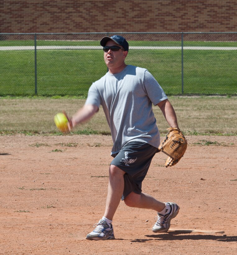 Chief Master Sgt. Brian Lavoie, 28th Bomb Wing command chief, delivers a pitch at the annual Eagles vs. Chiefs softball game during the base picnic at Ellsworth Air Force Base, S.D., Aug. 17, 2012. After nine long innings, the Chiefs pulled out a win with the score of 14-6. (U.S. Air Force photo by Airman 1st Class Alystria Maurer/Released)