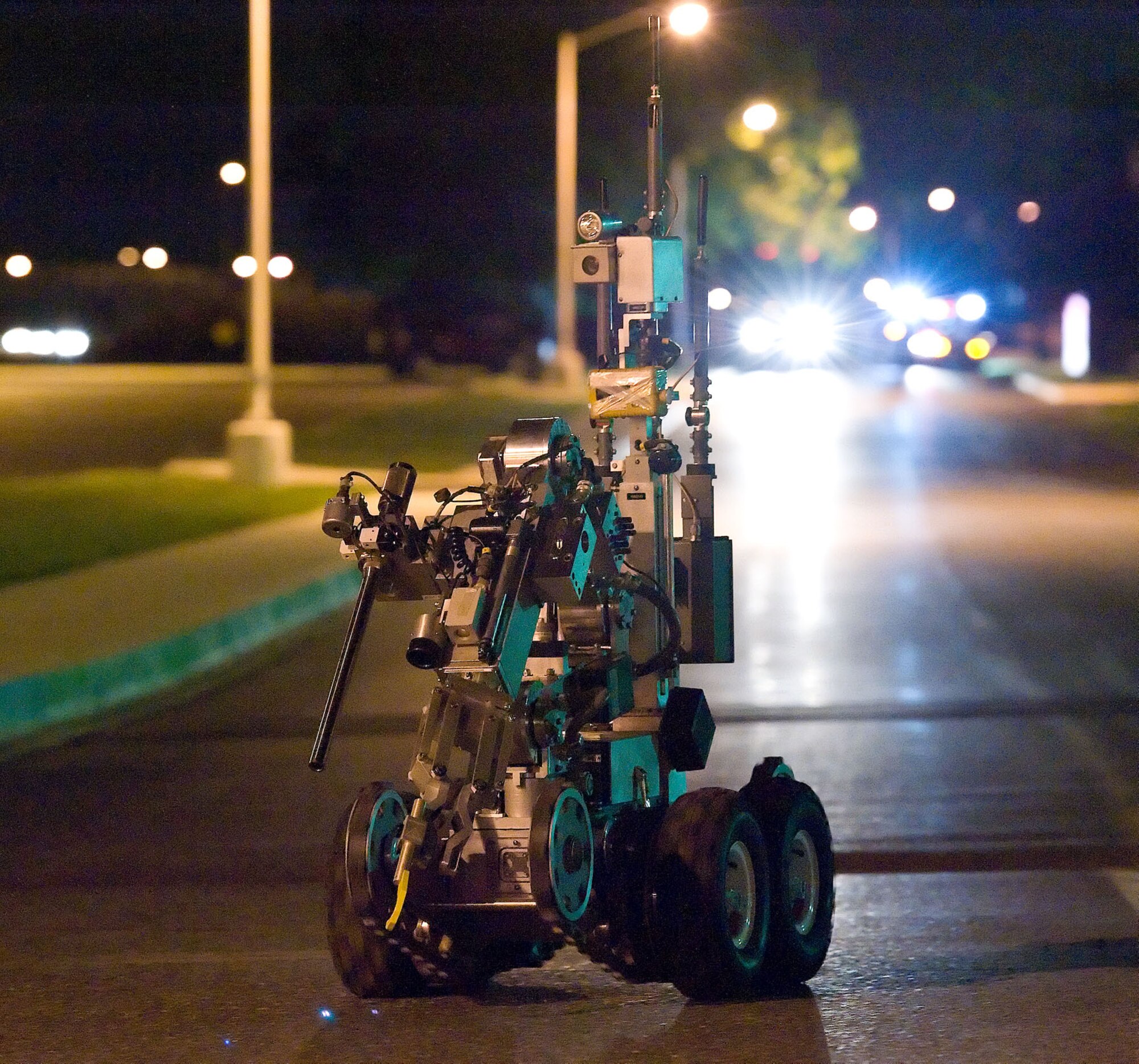The Andros F6A Explosive Ordnance Disposal unmanned robot is remotely guided down Arnold Street towards the Commercial Vehicle Inspection Facility Aug. 20, 2012, at Dover Air Force Base, Del. The robot was used to simulate an inspection of a suspicious vehicle as part of the Aug. 20-22 Major Accident Response Exercise, held to test Team Dover's readiness to respond to threats and emergencies. Dover AFB partnered with members of the local community during the MARE to strengthen cooperation and communication between emergency agencies. (U.S. Air Force photo by Roland Balik)