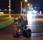 The Andros F6A Explosive Ordnance Disposal unmanned robot is remotely guided down Arnold Street towards the Commercial Vehicle Inspection Facility Aug. 20, 2012, at Dover Air Force Base, Del. The robot was used to simulate an inspection of a suspicious vehicle as part of the Aug. 20-22 Major Accident Response Exercise, held to test Team Dover's readiness to respond to threats and emergencies. Dover AFB partnered with members of the local community during the MARE to strengthen cooperation and communication between emergency agencies. (U.S. Air Force photo by Roland Balik)
