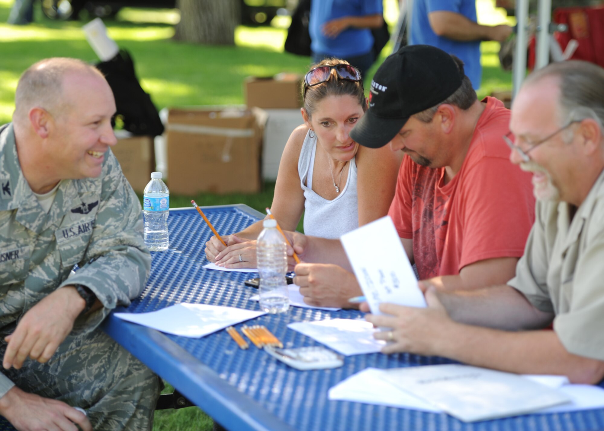 Col. Konrad Klausner, 92nd Mission Support Group commander, speaks to the judges of the Air Mobility Command Icon competition before going on stage to give the results in Miller Park at Fairchild Air Force Base, Wash., Aug. 17, 2012. The winner of the event is flown to Shaw Air Force Base, Ill. To compete against 11 other Airmen from AMC, each of whom won first place prizes at their constituent bases. (U.S. Air Force photo by Staff Sgt. Michael Means)