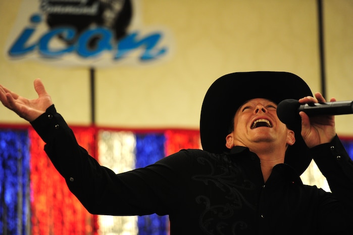 Master Sgt. Jason Shamis, from the 315th Maintenance Squadron, sings during the Air Mobility Command Icon Aug. 16, 2012 at Joint Base Charleston – Air Base, S.C. Shamis took second place in the contest and received $300.Each major installation within AMC is conducting a base-level AMC Icon contest. The first place winner from each of the installations will compete in the command finals Oct. 25, 2012 at Scott Air Force Base, Ill. Sabrina Begay, spouse of Staff Sgt. Marc Begay from the 437th Aircraft Maintenance Squadron, will represent JB Charleston in the AMC finals.  (U.S. Air Force photo/ Staff Sgt. Nicole Mickle)