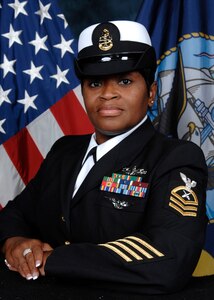 U.S. Navy Chief Petty Officer Stephanie Green, Naval Consolidated Brig Charleston Parole and Release department leading chief petty officer, was awarded the Palmetto Chapter of Women in Defense, Military Woman of the Year plaque at the Charleston RiverDogs game Aug. 11, 2012 in Charleston, S.C. Green was one of 15 local military women nominated for the award. (U.S. Air Force photo/Airman 1st Class Ashlee Galloway)