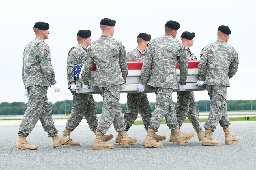 A U.S. Army carry team transfers the remains of Army Chief Warrant Officer Suresh N. A. Krause of Cathedral City, Calif., at Dover Air Force Base, Del., Aug 19, 2012. Krause was assigned to the 2nd Battalion, 25th Aviation Regiment, 25th Combat Aviation Brigade, 25th Infantry Division, Schofield Barracks, Hawaii. (U.S. Air Force photo/Adrian R. Rowan)