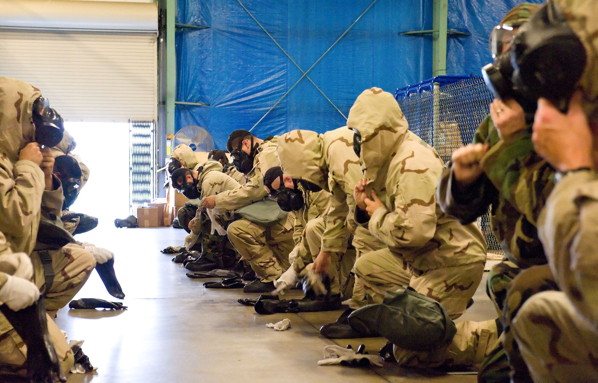 Airmen are evaluated on their ability to progress from Measure Oriented Protective Posture 2 to MOPP 4 within two minutes. The 436th Civil Engineer Squadron Emergency Management and Training Section provides this training. (U.S. Air Force photo by Roland Balik)