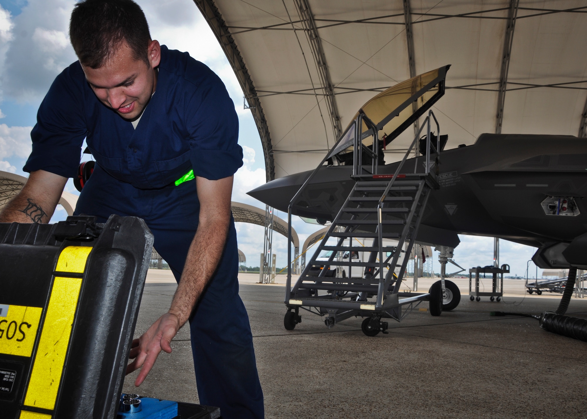 Staff Sgt. Douglas Bays, a crew chief with the 57th Aircraft Maintenance Unit, selects tools for post-flight maintenance tasks on an F-35A Lightning II at Eglin Air Force Base, Fla., Aug. 16.  Bays is here training in anticipation for when the 57th will stand up its F-35 flying operations later next year. Bays is one of three maintainers from Nellis Air Force Base, Nev., being trained on the F-35. Once their training is complete, they'll provide maintenance support to the 422nd Test and Evaluation Squadron's F-35 fleet. The 422nd is a geographically separated unit of the 53rd Wing, headquartered at Eglin. (U.S. Air Force photo/Karen Roganov)
