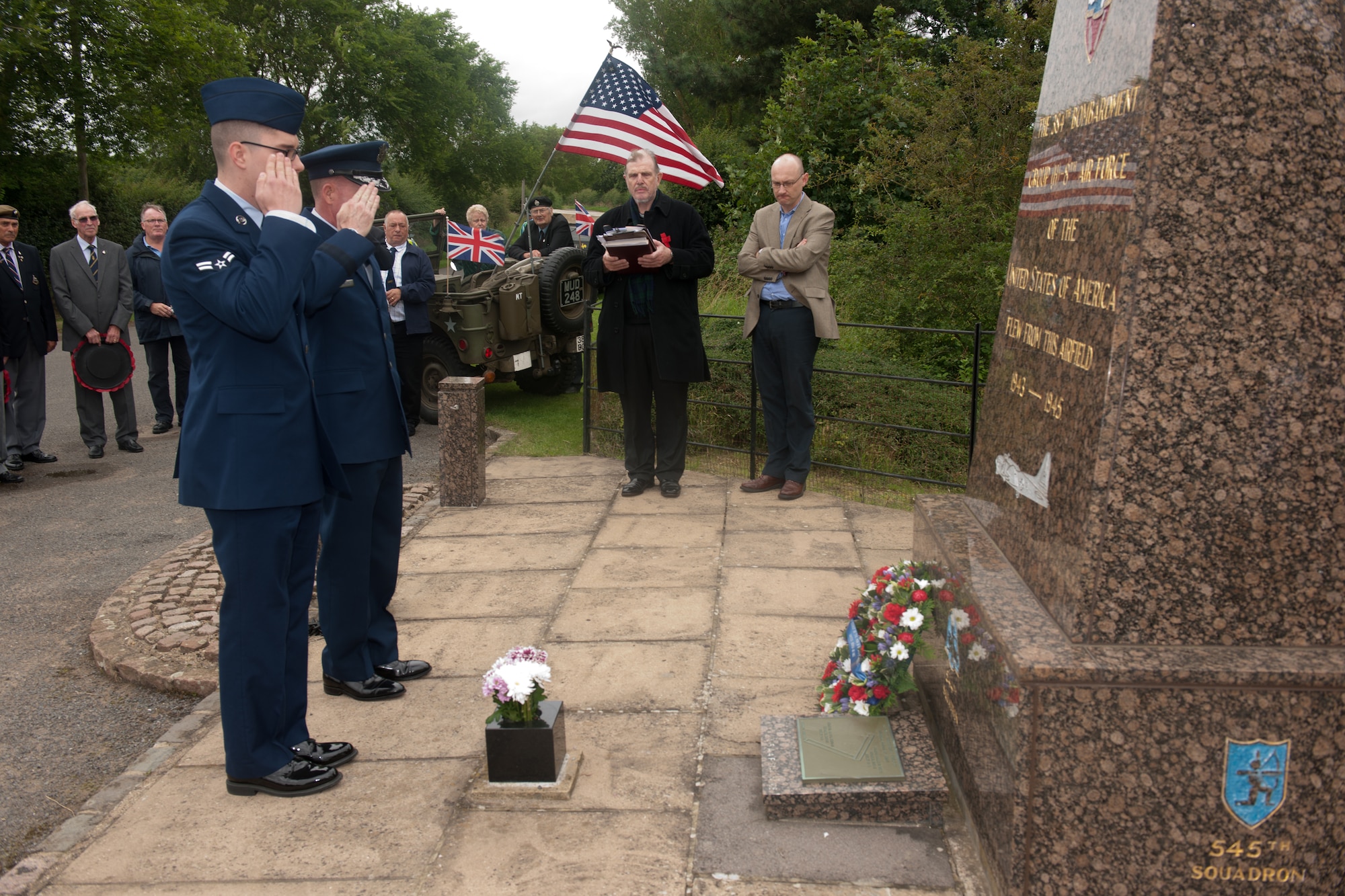 GRAFTON UNDERWOOD, United Kingdom – Maj. Gen. Stephen Wilson, Eighth Air Force commander, and Airman 1st Class Cody Lemon, 423rd Medical Squadron, pay their respects to Eighth Air Force Airmen at the memorial near Grafton Underwood Aug. 17. The day marked the 70th anniversary of the first Eighth Air Force bombers, from the 97th Bombardment Group (Heavy), participating in World War II which launched from Grafton Underwood. Col. Frank Armstrong, 97th BG commander, and the 340th Bomb Squadron commander Maj. Paul Tibbets (who later flew the Enola Gay to Hiroshima, Japan, on the first atomic bomb mission) piloted the lead aircraft of the group, Butcher Shop. In the leading aircraft of the second flight, Yankee Doodle, flew Gen. Ira C. Eaker, the commanding general of the VIII Bomber Command. (U.S. Air Force photo by Staff Sgt. Brian Stives)