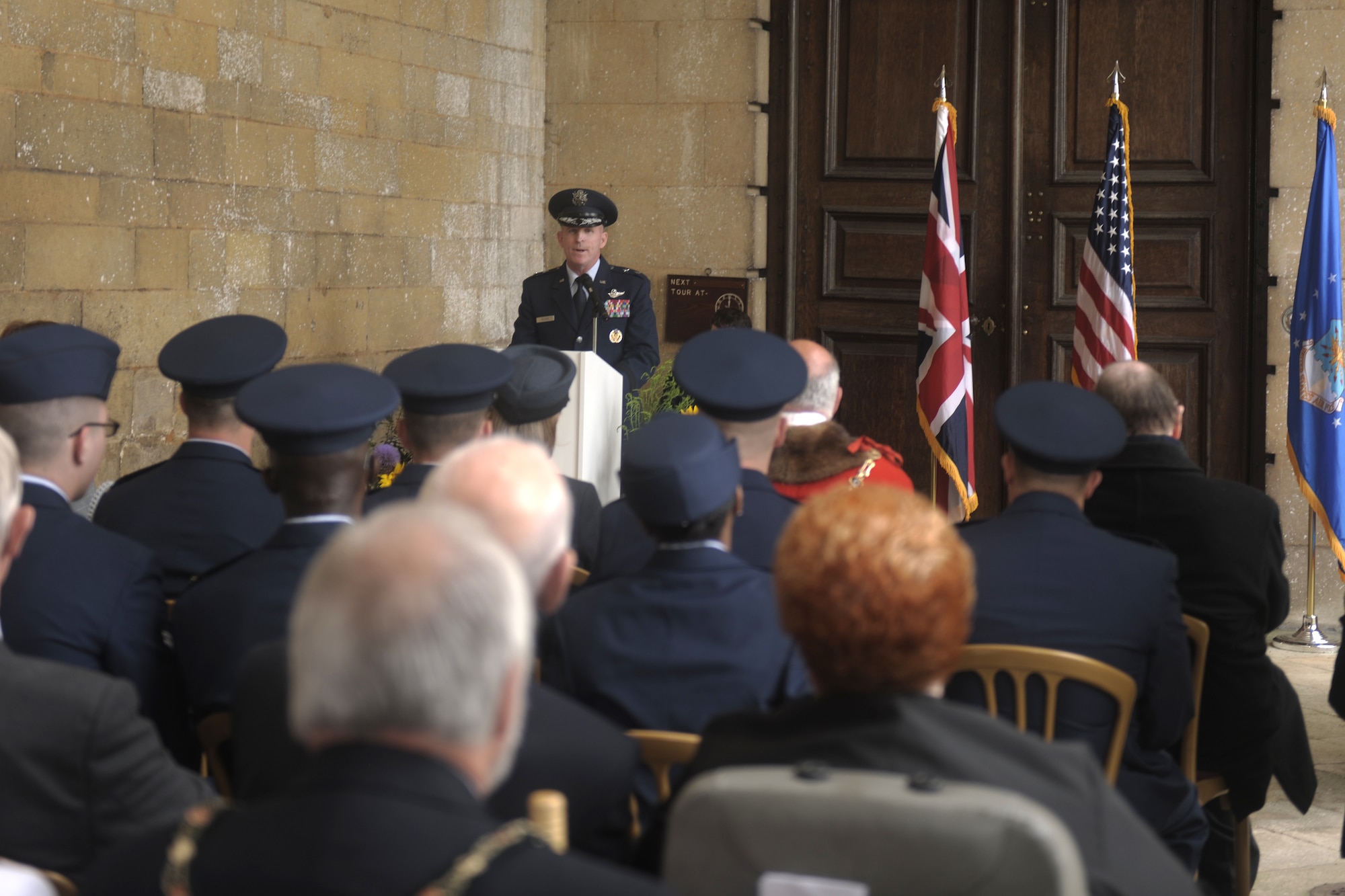 GRAFTON UNDERWOOD, United Kingdom – Maj. Gen. Stephen Wilson, Eighth Air Force commander, speaks to a crowd of more than 200, including Royal Air Force Air Commodore R.L. Atherton, representing the United Kingdom Ministry of Defence and Air Chief Marshall Sir Stephen Dalton, RAF Chief of Air Staff; Col. Brian Kelly, 501st Combat Support Wing commander; local community leaders from Kettering, United Kingdom; and veterans at Boughton House Aug. 17. The day marked the 70th anniversary of the first Eighth Air Force bombers, from the 97th Bombardment Group (Heavy), participating in World War II which launched from Grafton Underwood. Col. Frank Armstrong, 97th BG commander, and the 340th Bomb Squadron commander Maj. Paul Tibbets (who later flew the Enola Gay to Hiroshima, Japan, on the first atomic bomb mission) piloted the lead aircraft of the group, Butcher Shop. In the leading aircraft of the second flight, Yankee Doodle, flew Gen. Ira C. Eaker, the commanding general of the VIII Bomber Command. (U.S. Air Force photo by Staff Sgt. Brian Stives)