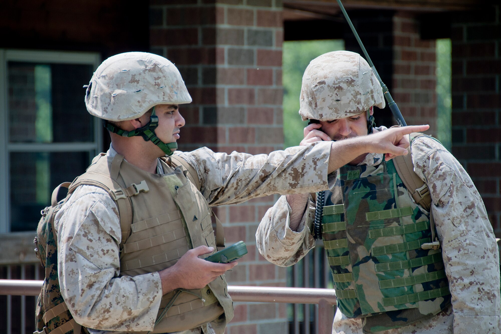 KENSINGTON, Ohio -- U.S. Marine Corps Reserve Lance Cpl. Joseph R. Shakibanasab from 4th LSB in Charleston, S.C., surveys the surrounding area while Lance Cpl. Charles M. Steelman from 4th LSB based at Youngstown Air Reserve Station, Ohio, relays the information back to senior leadership Aug. 15, 2012 at Seven Ranges Scout Camp here. Airmen, Marines and Sailors from YARS participated in a two-week joint training exercise at the camp and worked together to improve roads and drainage systems, erect campsites and excavate land for future projects. U.S. Air Force photo by Staff Sgt. Megan Tomkins/Released