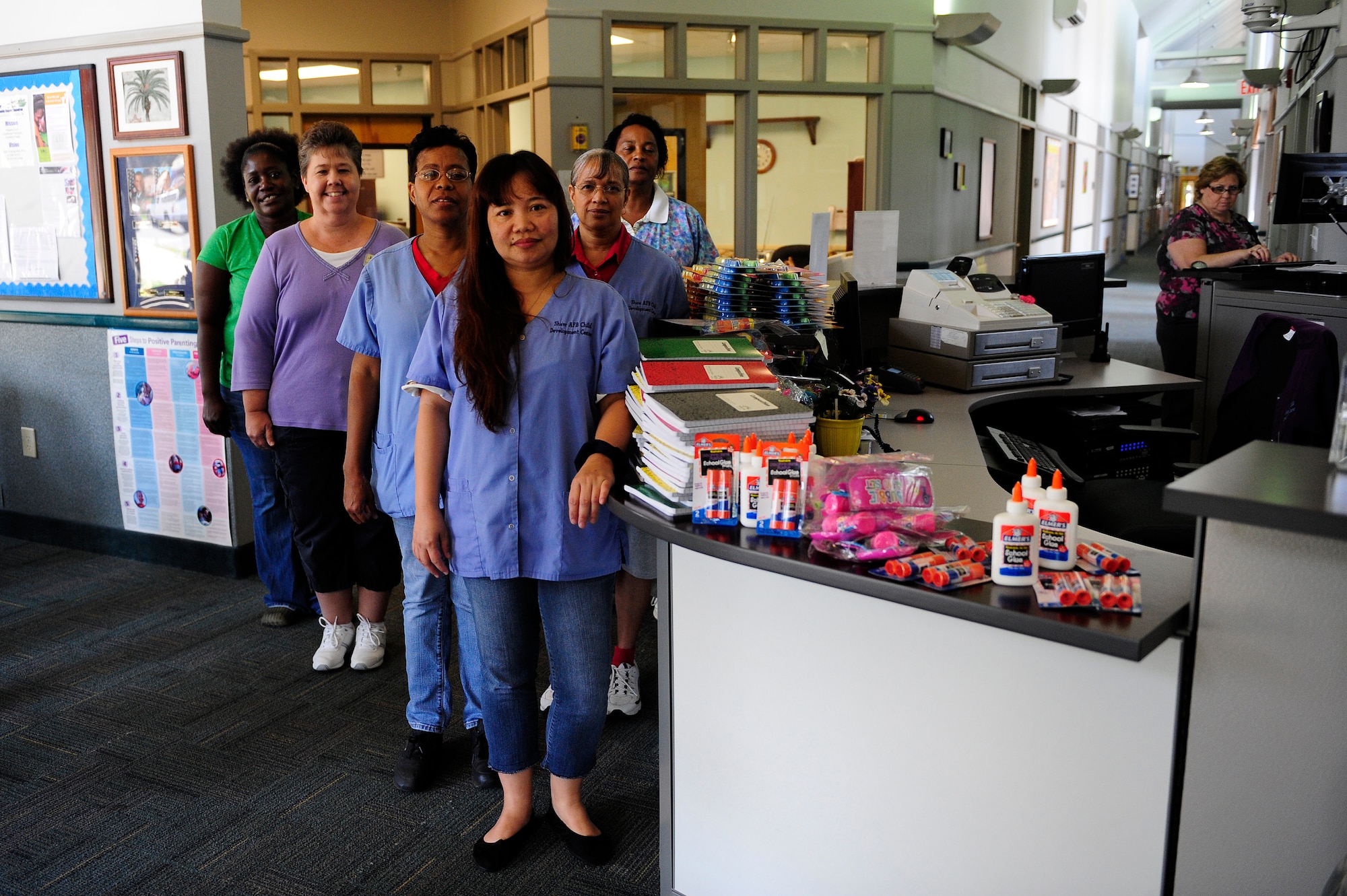 Teachers from the Childcare Development Center pose for a photo after receiving school supplies from the city of Sumter, Shaw Air Force Base, S.C., Aug. 15, 2012. The city of Sumter donated these supplies to encourage children to have fun, learn and be creative. (U.S. Air Force photo by Airman 1st Class Hunter Brady /Released)