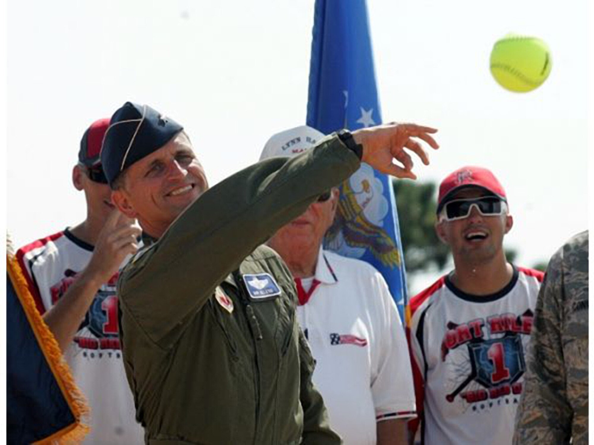 Brig. Gen. Robert Beletic, 1st Air Force (Air Forces Northern) Vice Commander, tosses out the first pitch during opening ceremonies of the 2012 United States Specialty Sports Association (USSSA) Military World Softball Opening Ceremonies August 16. The annual four-day tournament, held at Frank Brown Park in Panama City Beach, features teams from all the military services from bases all over the United States. This year, more than 100 teams competed, including the Wounded Warriors Amputee Softball Team. (Photo Courtesy Panama City News Herald)