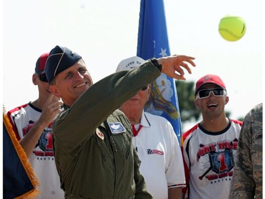Brig. Gen. Robert Beletic, 1st Air Force (Air Forces Northern) Vice Commander, tosses out the first pitch during opening ceremonies of the 2012 United States Specialty Sports Association (USSSA) Military World Softball Opening Ceremonies August 16. The annual four-day tournament, held at Frank Brown Park in Panama City Beach, features teams from all the military services from bases all over the United States. This year, more than 100 teams competed, including the Wounded Warriors Amputee Softball Team. (Photo Courtesy Panama City News Herald)